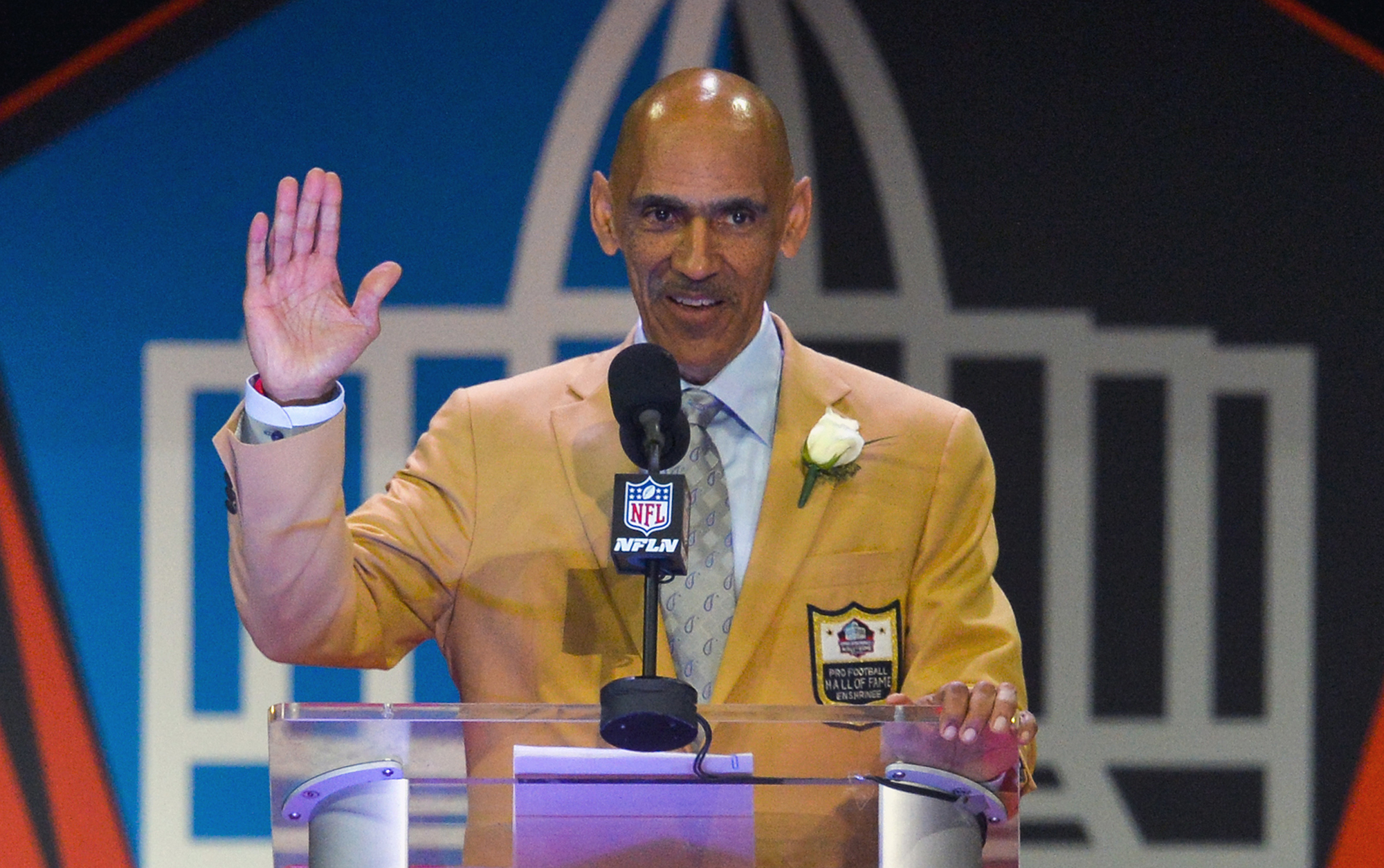 FILE - In this Aug. 6, 2016, file photo, former NFL player and coach Tony Dungy delivers a speech during an induction ceremony at the Pro Football Hall of Fame in Canton, Ohio. Dungy was part of South Florida’s pitch to the Big 12 and former major league first baseman Tino Martinez also went to bat for the Bulls. (AP Photo/David Richard, File)