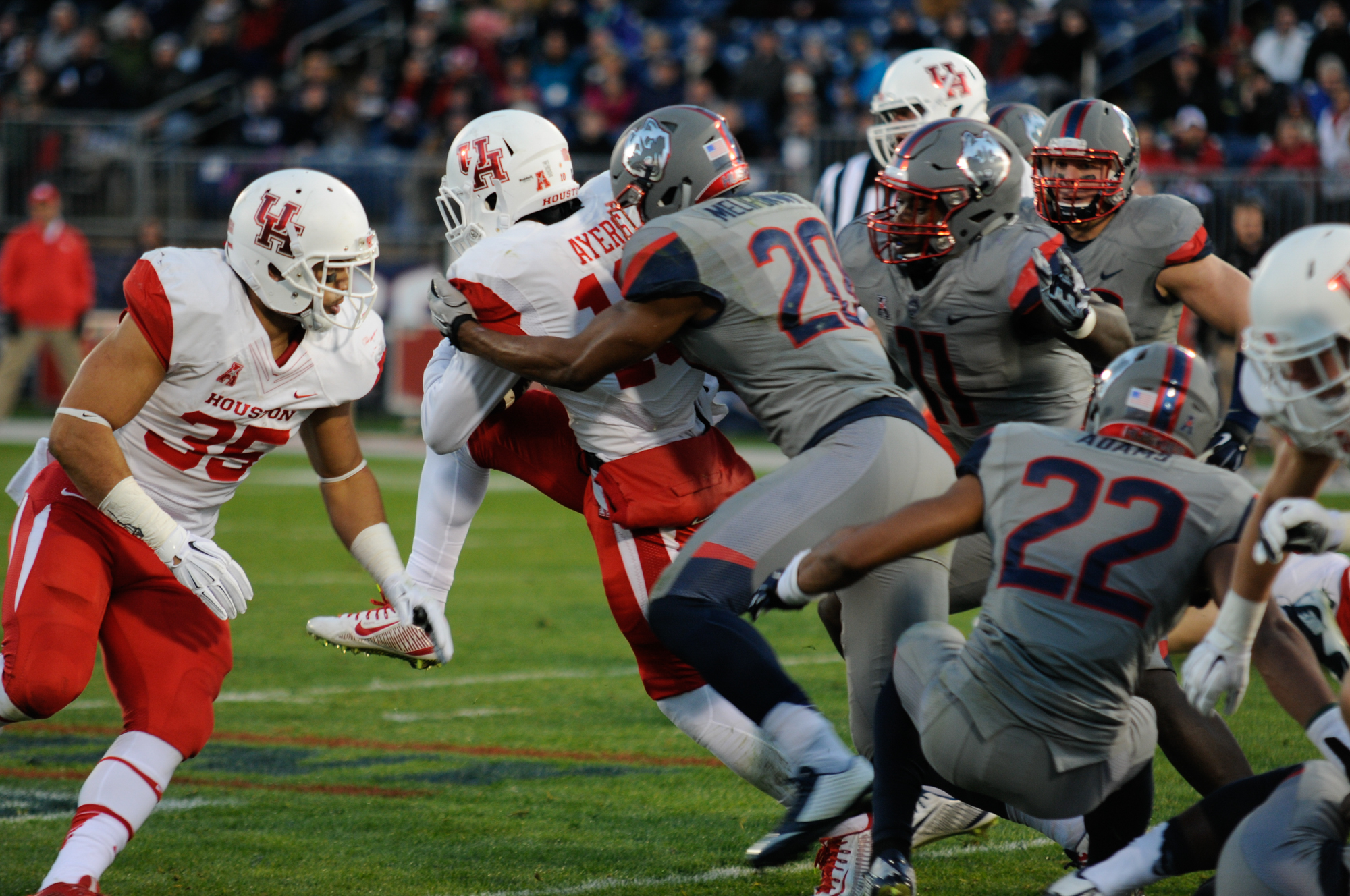 The UConn defensive line tackles a member of the University of Houston offensive line during the Huskies end of season win over the Cougars on Nov. 21, 2016. (Amar Batra/The Daily Campus)