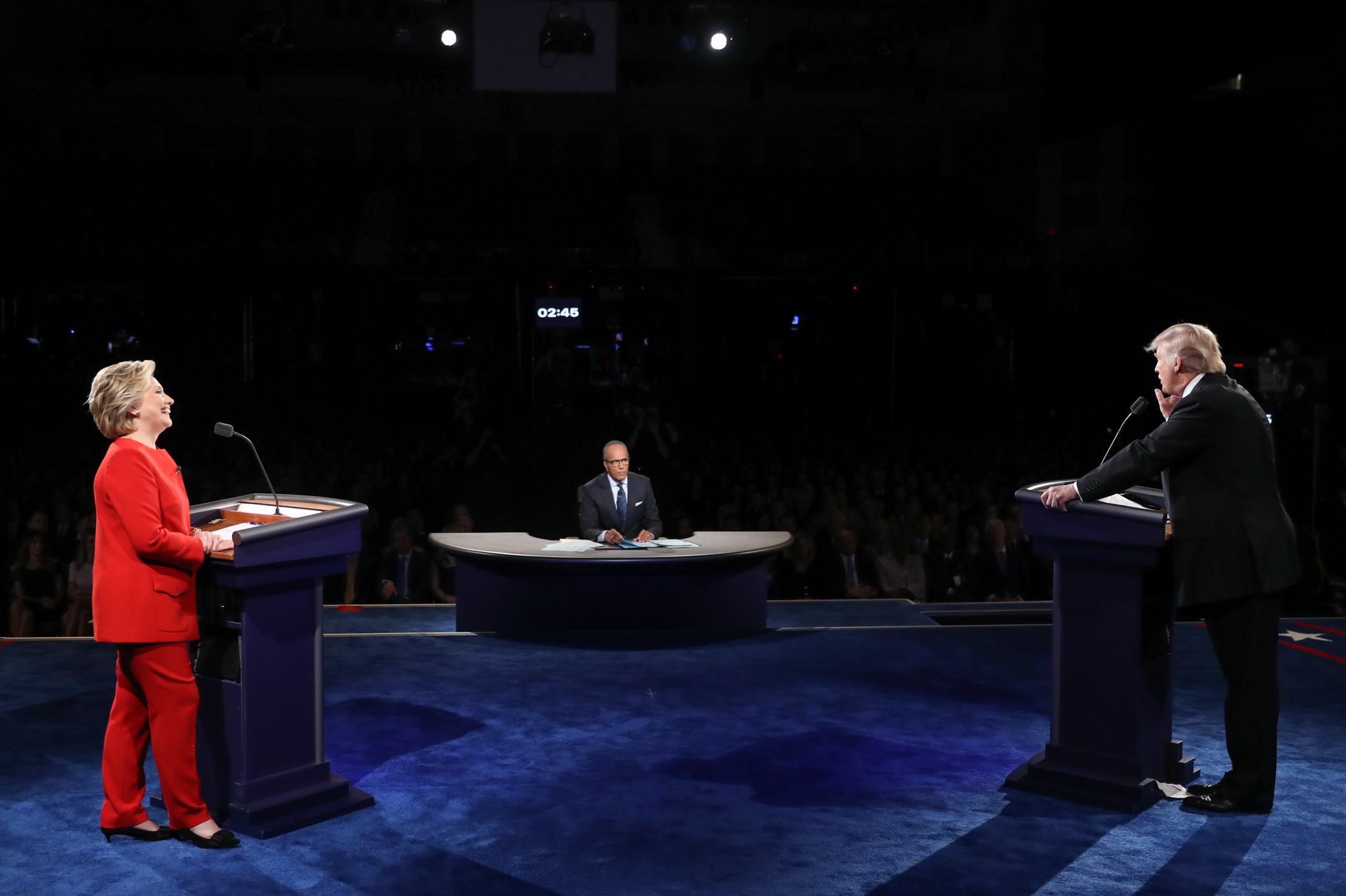 Democratic presidential nominee Hillary Clinton listens as Republican presidential nominee Donald Trump answers a question during the presidential debate at Hofstra University in Hempstead, N.Y., Monday, Sept. 26, 2016. (Joe Raedle/AP)