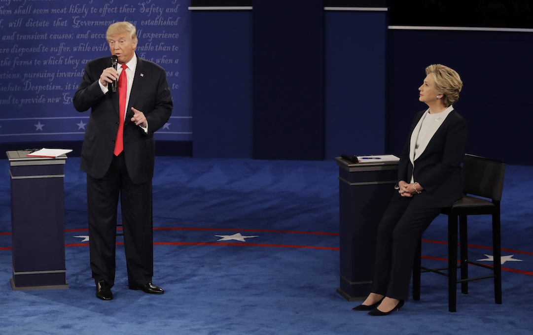 Democratic presidential nominee Hillary Clinton listens to Republican presidential nominee Donald Trump during the second presidential debate at Washington University in St. Louis, Sunday, Oct. 9, 2016. (Patrick Semansky/AP)