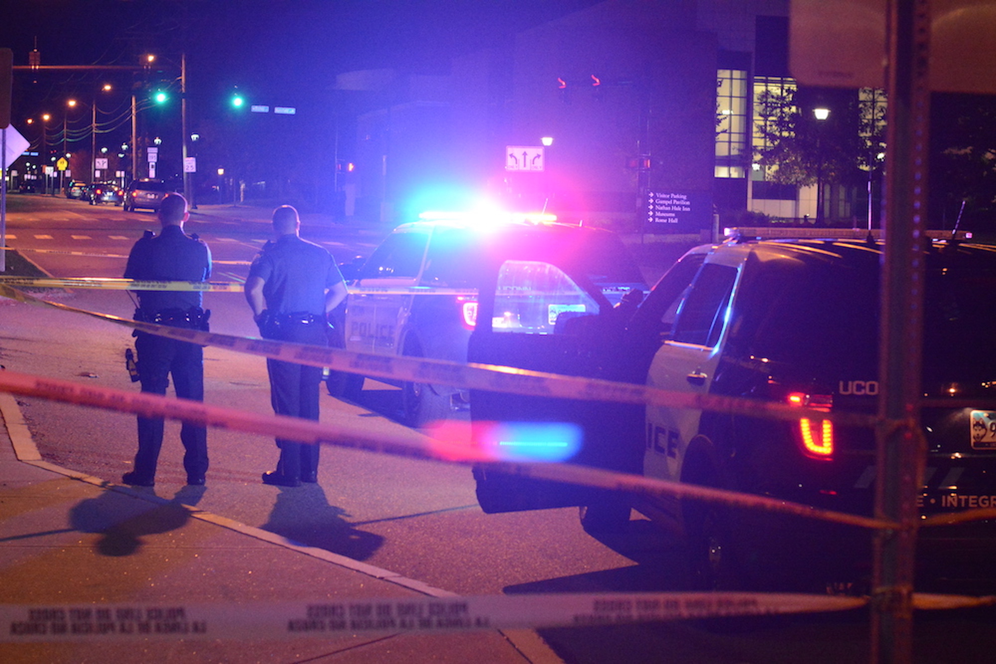 UConn police officers Douglas Lussier (left) and Tyler Hopson (right) stand at the scene of the incident where a physical altercation took place around 9:45 p.m. on Tuesday, Oct. 11, 2016 in which two adults from Manchester were arrested for beating a victim unconscious in front of Shippee. (Cheyenne Haslett/The Daily Campus)