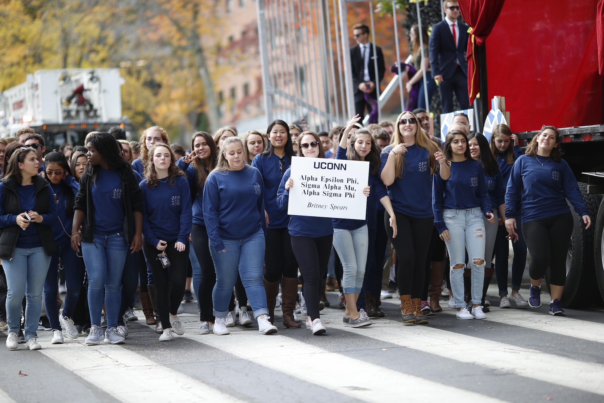Members of the Alpha Epsilon Phi organization march in the Homecoming parade on )ct. 16, 2017. This year's theme was music and saw floats featuring Coldplay and Drake(Tyler Benton/The Daily Campus) 