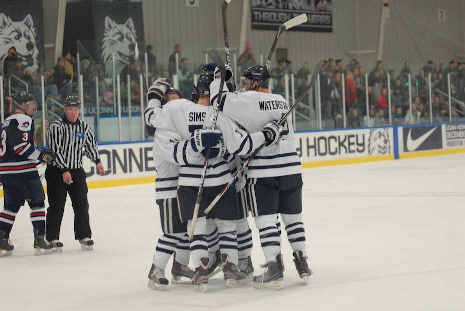 Bruce Marshall's Huskies celebrate a goal in a game against Robert Morris University on Jan. 20, 2012 at the Freitas Ice Forum. Marshall, a former player and head coach for UConn, passed away Saturday morning. (File photo)