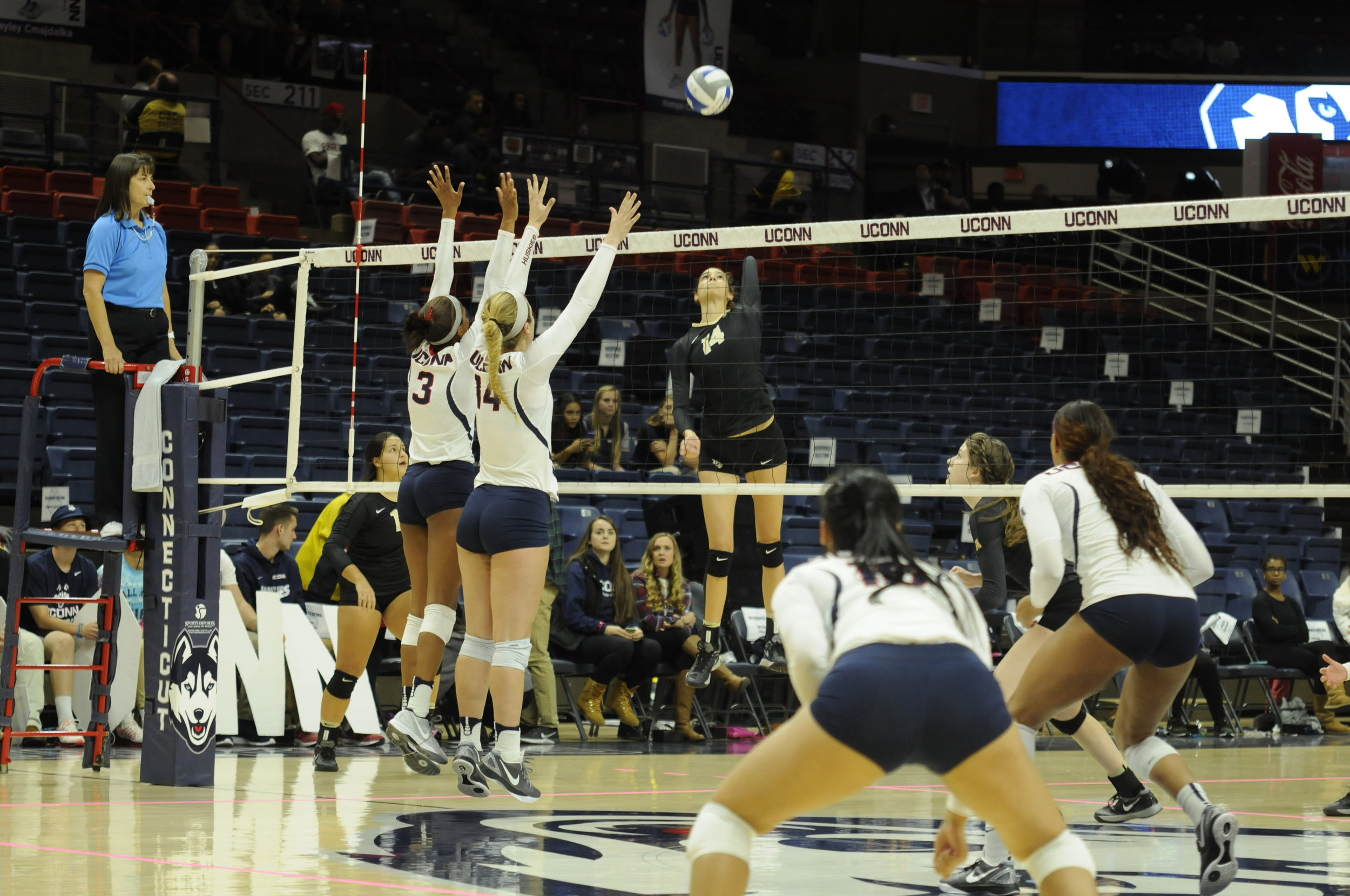 Senior Hayley Cmaidalka and sophomore Emma Turner go to block the ball during their game against UCF Oct. 14, 2016. Even though our girls tried their best, we still lose the game. The girls lost again this Friday, Oct. 21 to Cincinnati University and again to East Carolina University. The Huskies play their next match this Wednesday at Temple University at 5 p.m. in Philadelphia. (Junbo Huang/The Daily Campus)