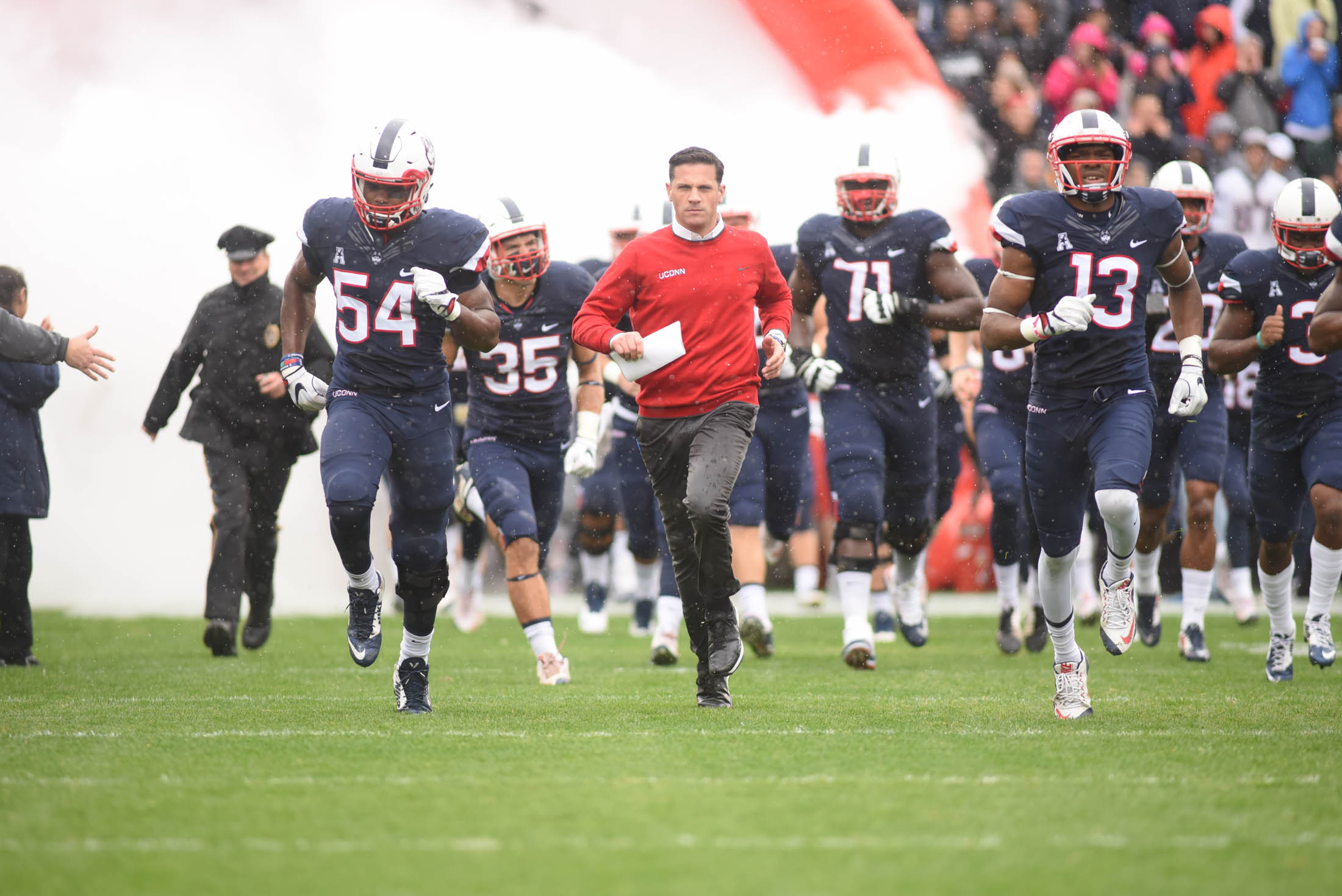Head coach Bob Diaco takes the field with his team ahead of the Huskies 24-16 loss to the UCF Knights during the "Civil ConFLiCT" on Saturday, Oct. 22, 2016 at Rentschler Field. Diaco addressed the importance and the end of the rivalry game at a press conference on Tuesday afternoon. (Zhelun Lang/The Daily Campus)