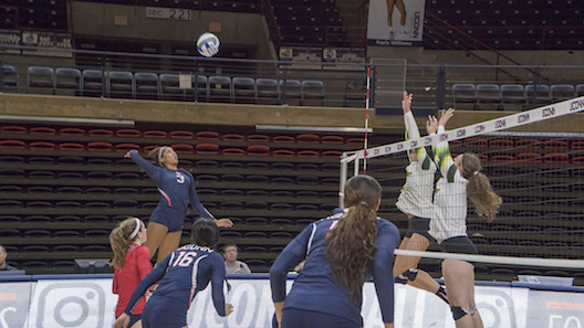 UConn's Jade Strawberry (#3) spikes the ball in a game against USF on Oct. 16, 2016. The Huskies return home this weekend to take on Memphis. (Bill Heyne/The Daily Campus)