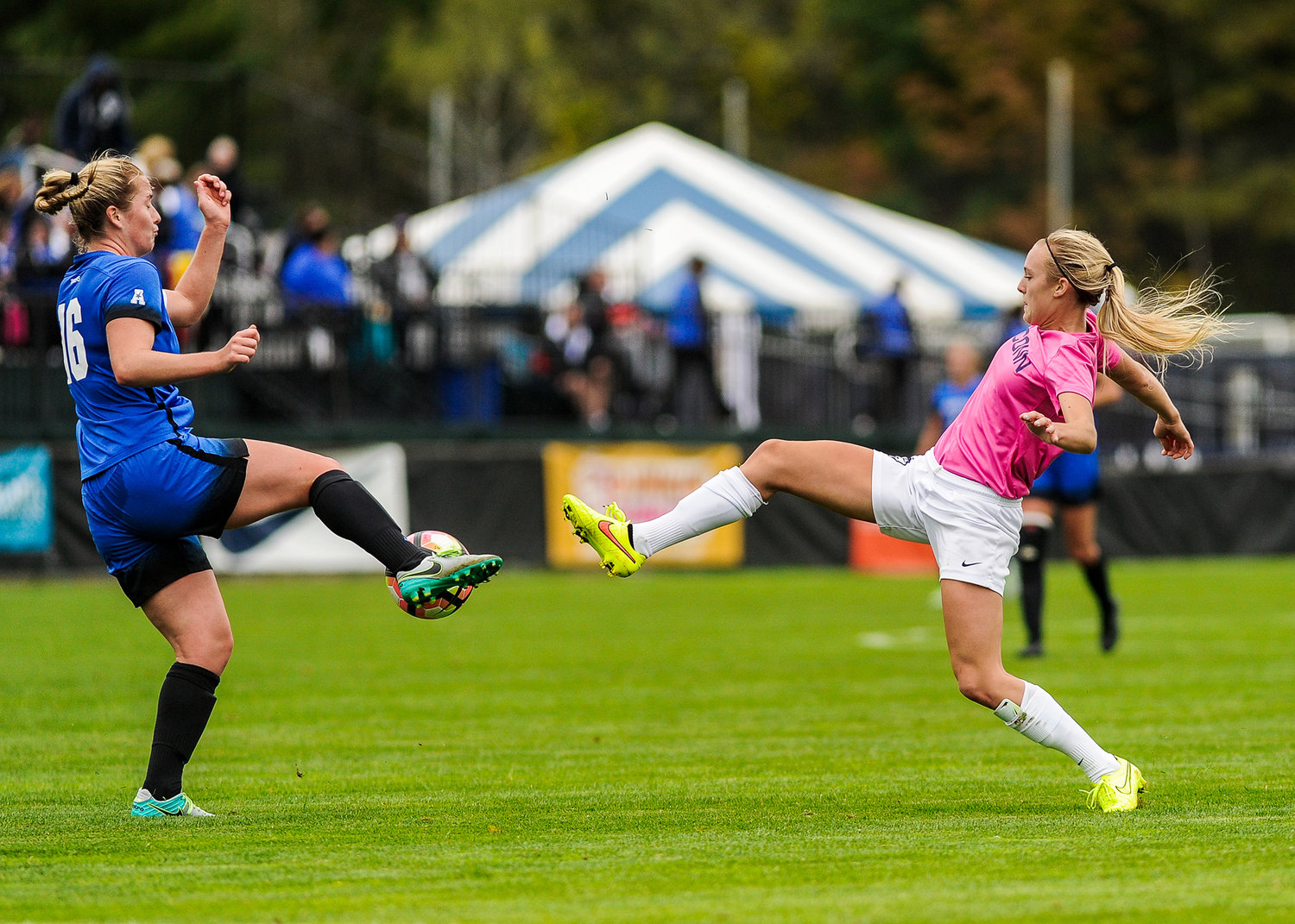 UConn forward Rachel Hill kicks a ball past a Memphis opponent at Joseph J. Morrone Stadium on Sunday, Oct. 2, 2016. The Huskies won 4-1. (Jason Jiang/The Daily Campus)