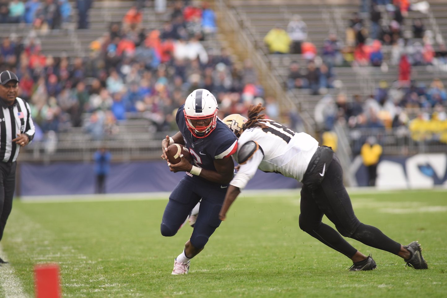 UConn's Arkeel Newsmen makes a bid for the end zone during UConn's 24-16 loss to UCF on Saturday Oct. 22, 2016 at Rentschler Field. (Zhelun Lang/The Daily Campus)