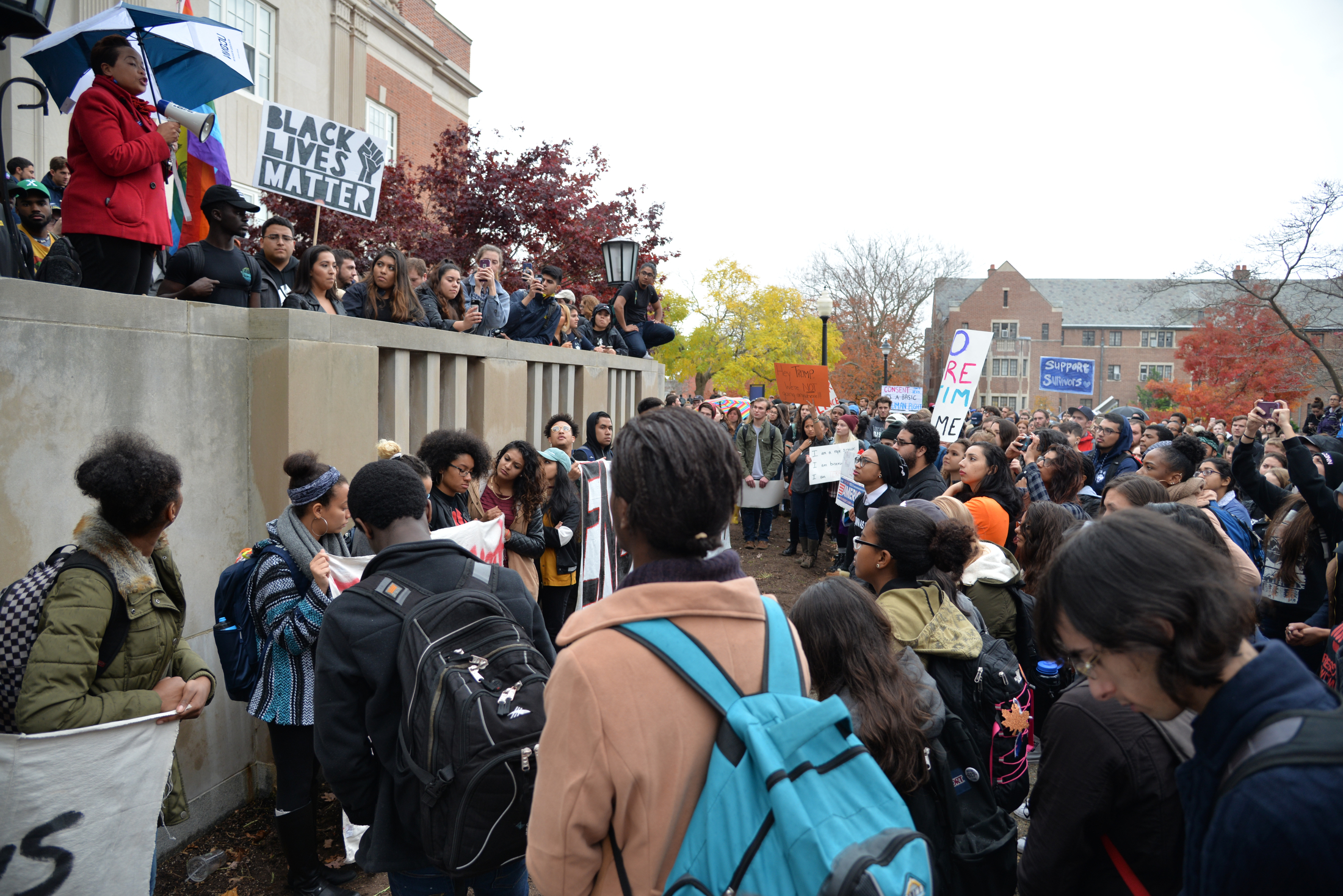 UConn Chief Diversity Officer Joelle Murchison addresses students at the "Rally for the People" as rally organizer Eric Cruz Lopez looks on outside Wilbur Cross on Wednesday, Nov. 9, 2016. The rally was organized by undocumented students at the university to protest the election results. (Amar Batra/The Daily Campus) 