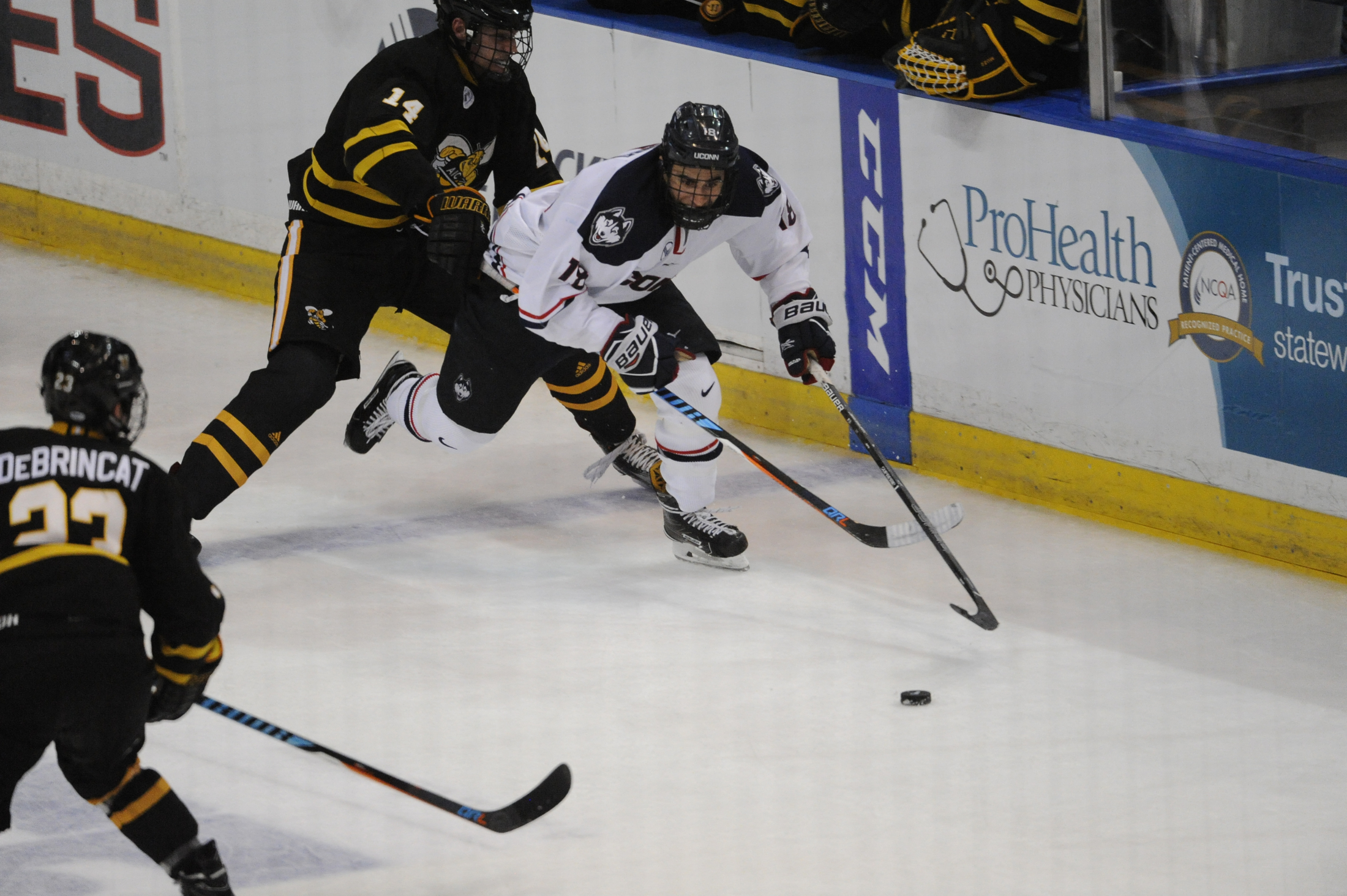 Forward Max Kelter (18) avoids forward Jared Pike (14) during the Huskies 2-2 tie against the AIC Hornets on Oct. 23, 2016 at the XL Center in Hartford, CT. (Jason Jiang/The Daily Campus)