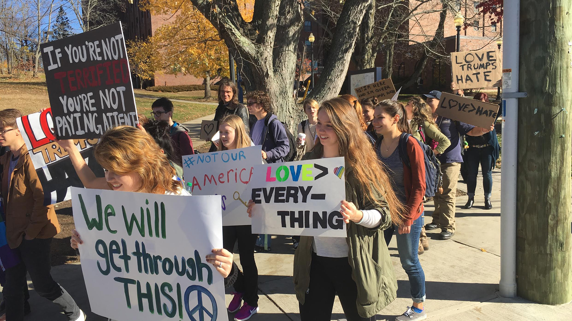 EO Smith High School student gather in Storrs Center with signs and chants for a "Love Trumps Hate" rally on Monday afternoon. (Chris McDermott/The Daily Campus) 
