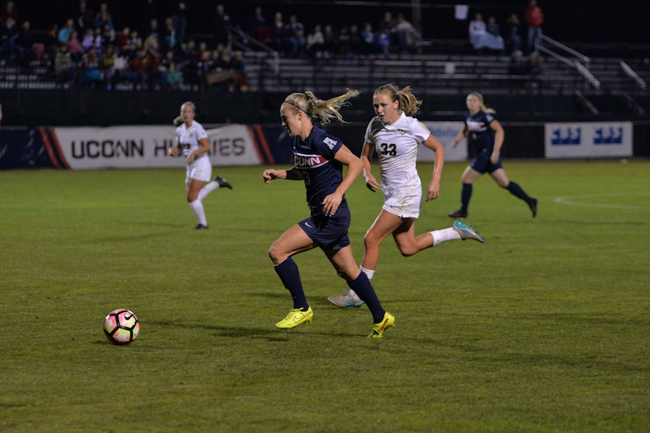 UConn senior forward Rachel Hill (#3) brings the ball up while being chased down by UCF junior defender Caroline Bado (#33) during a game on Thursday Oct. 13, 2016. UConn won the game 3-0 at Marrone Stadium. (Amar Batra/The Daily Campus)