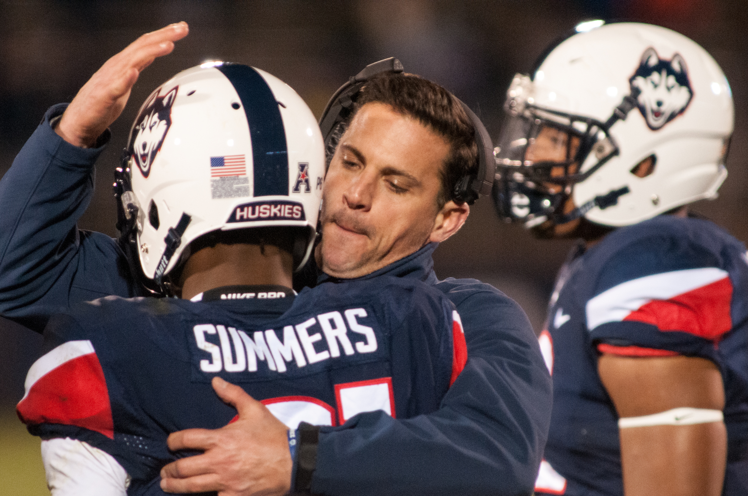 UConn head coach Bob Diaco hugs cornerback Jamar Summers during Saturday's 38-13 loss to Tulane at Rentschler Field in East Hartford. (Jackson Haigis/The Daily Campus)