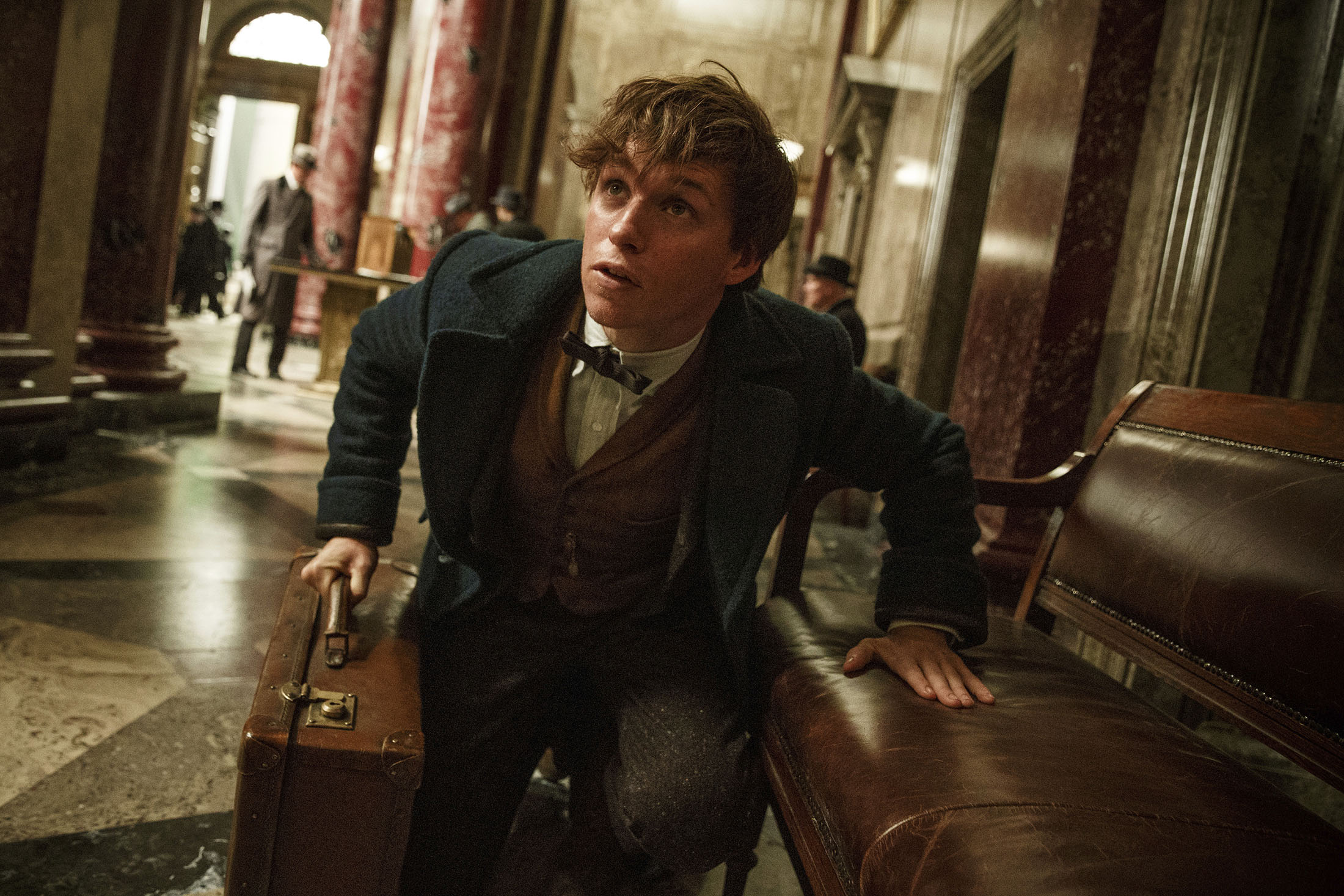 This image released by Warner Bros. Entertainment shows Eddie Redmayne in a scene from, " Fantastic Beasts and Where to Find Them." (Jaap Buitendijk/Warner Bros. via AP)