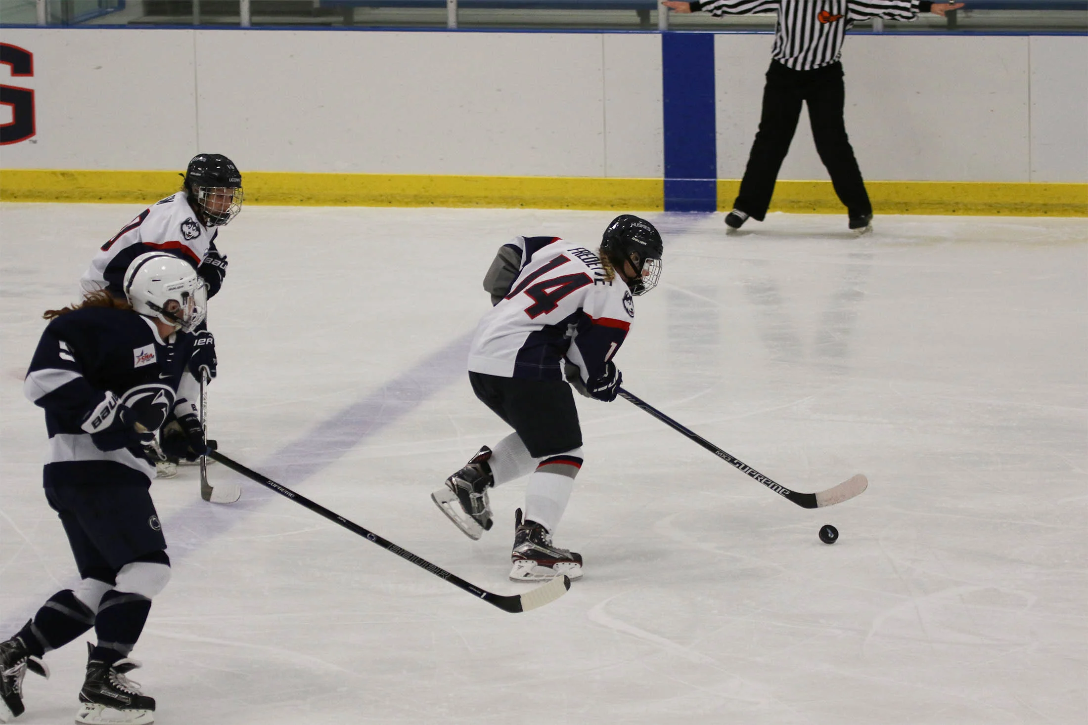 Junior Justine Fredette takes the puck down the ice in the game against Yale University this past weekend. (Ruohan Li/The Daily Campus) 