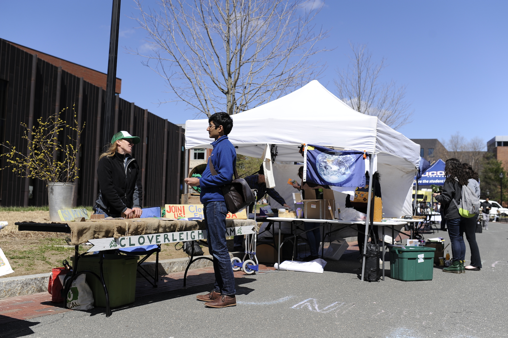 Students gather to interact with a multitude of eco-friendly exhibitors and vendors on Earth Day, April 19, 2016. The event hosts an outdoor zero-waste barbecue catered by Dining Services featuring vegan/vegetarian and sustainable food options. (Jason Jiang/The Daily Campus)