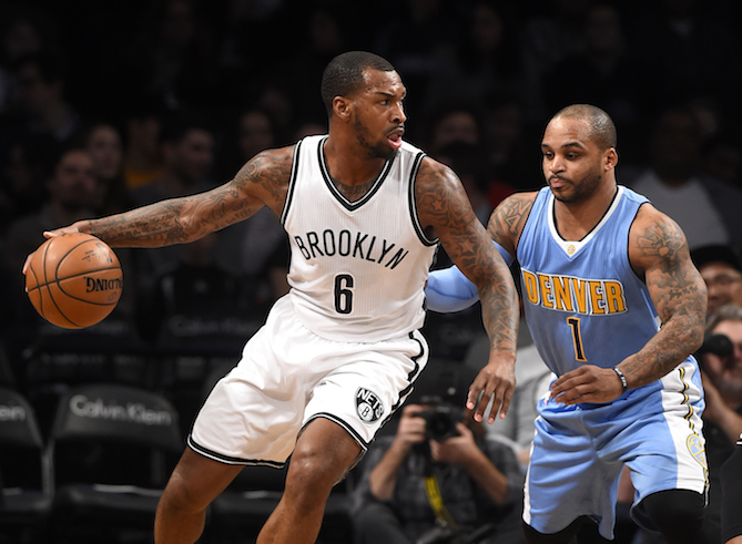 Brooklyn Nets guard Sean Kilpatrick (6) drives the ball around Denver Nuggets guard Jameer Nelson (1) in the first half of an NBA basketball game in New York, Wednesday, Dec. 7, 2016. The Nets won 116-111. (Kathy Kmonicek/AP Photo)
