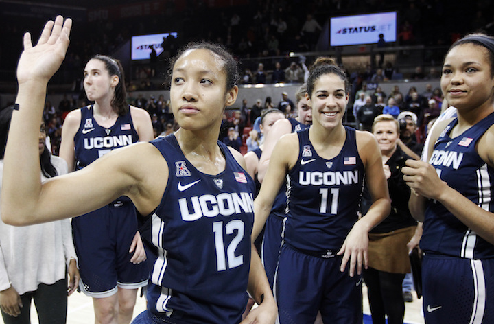 Connecticut guard Saniya Chong (12) and her teammates wave to fans after an NCAA college basketball game against SMU, Saturday, Jan. 14, 2017, in Dallas. Connecticut won 88-48, their 91st straight win. (Brandon Wade/AP Photo)