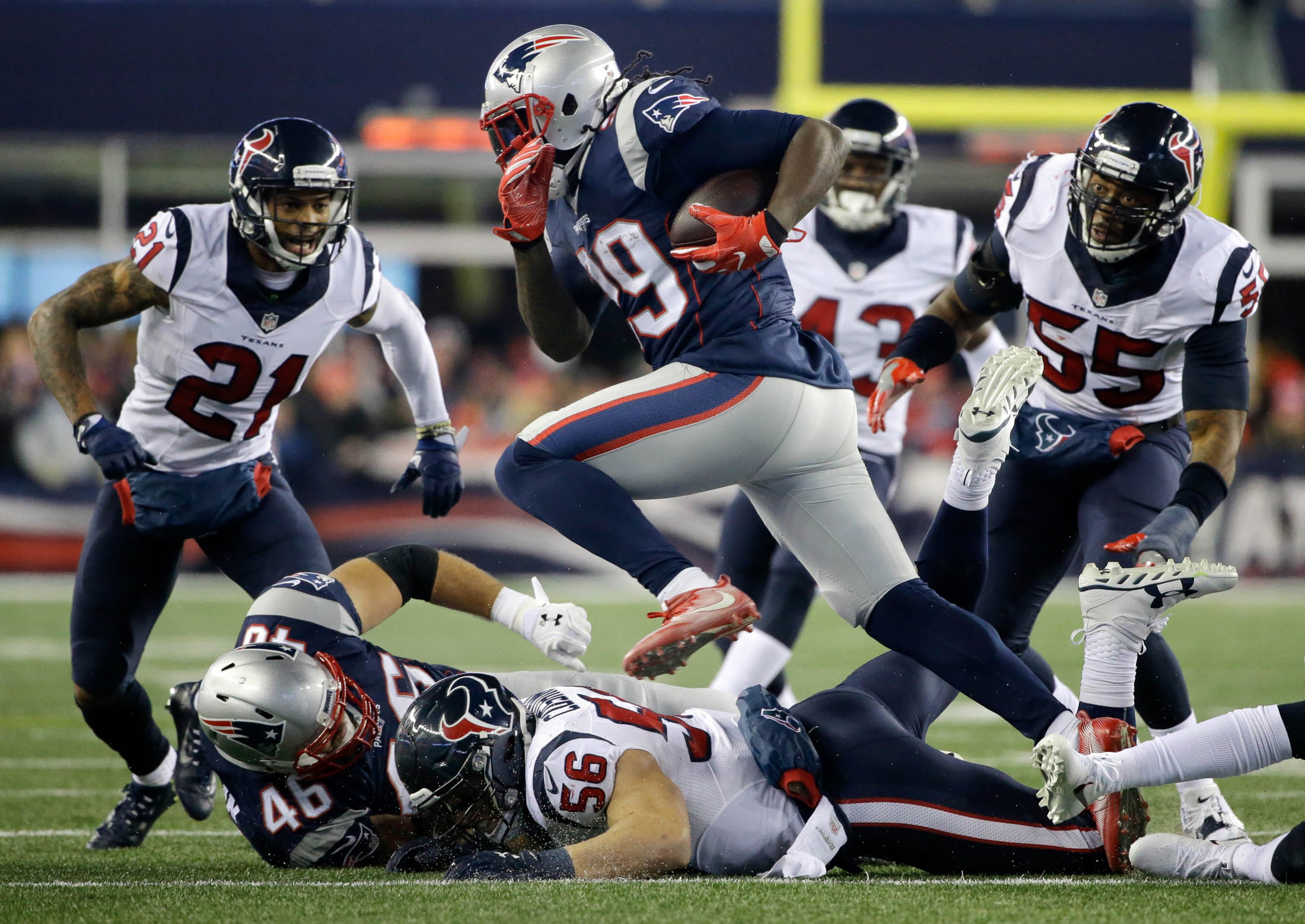 New England Patriots running back LeGarrette Blount (29) gains yardage as Houston Texans defenders A.J. Bouye (21) and Benardrick McKinney (55) pursue during the second half of an NFL divisional playoff football game, Saturday, Jan. 14, 2017, in Foxborough, Mass. (Elise Amendola/AP)