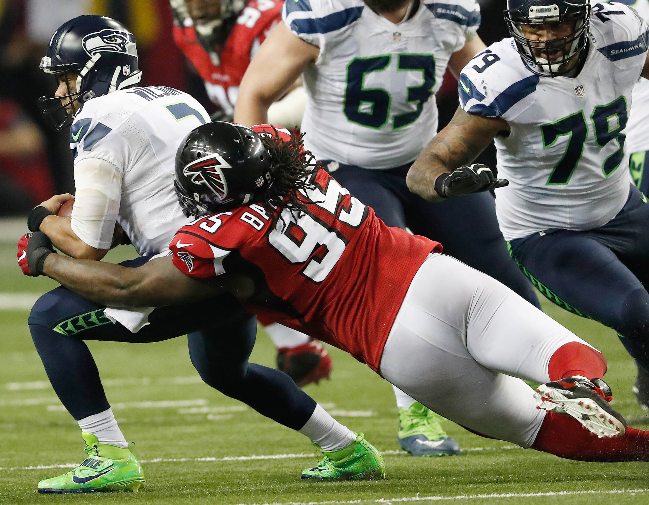 Atlanta Falcons defensive tackle Jonathan Babineaux (95) sacks Seattle Seahawks quarterback Russell Wilson (3) during the second half of an NFL football divisional football game, Saturday, Jan. 14, 2017, in Atlanta . The Falcons won 36-20.(John Bazemore/AP)