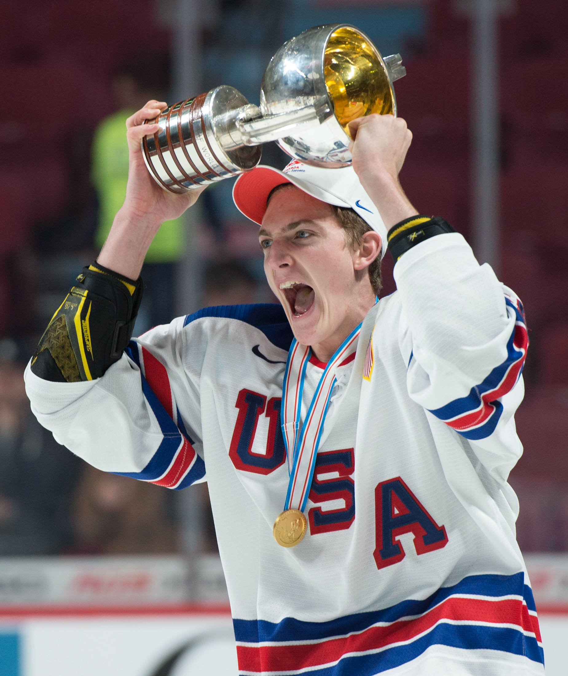 United States' Tage Thompson hoists the trophy after winning the gold medal over Canada after the final of the world junior hockey championship in Montreal on Thursday, Jan. 5, 2017. (Paul Chiasson/The Canadian Press,AP)