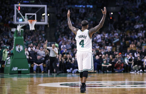 Boston Celtics guard Isaiah Thomas (4) raises his arms as he celebrates after hitting a 3-pointer against the Charlotte Hornets during the second half of an NBA basketball game in Boston, Monday, Jan. 16, 2017. Thomas had 35 points as the Celtics defeated the Hornets 108-98. (Charles Krupa/AP)