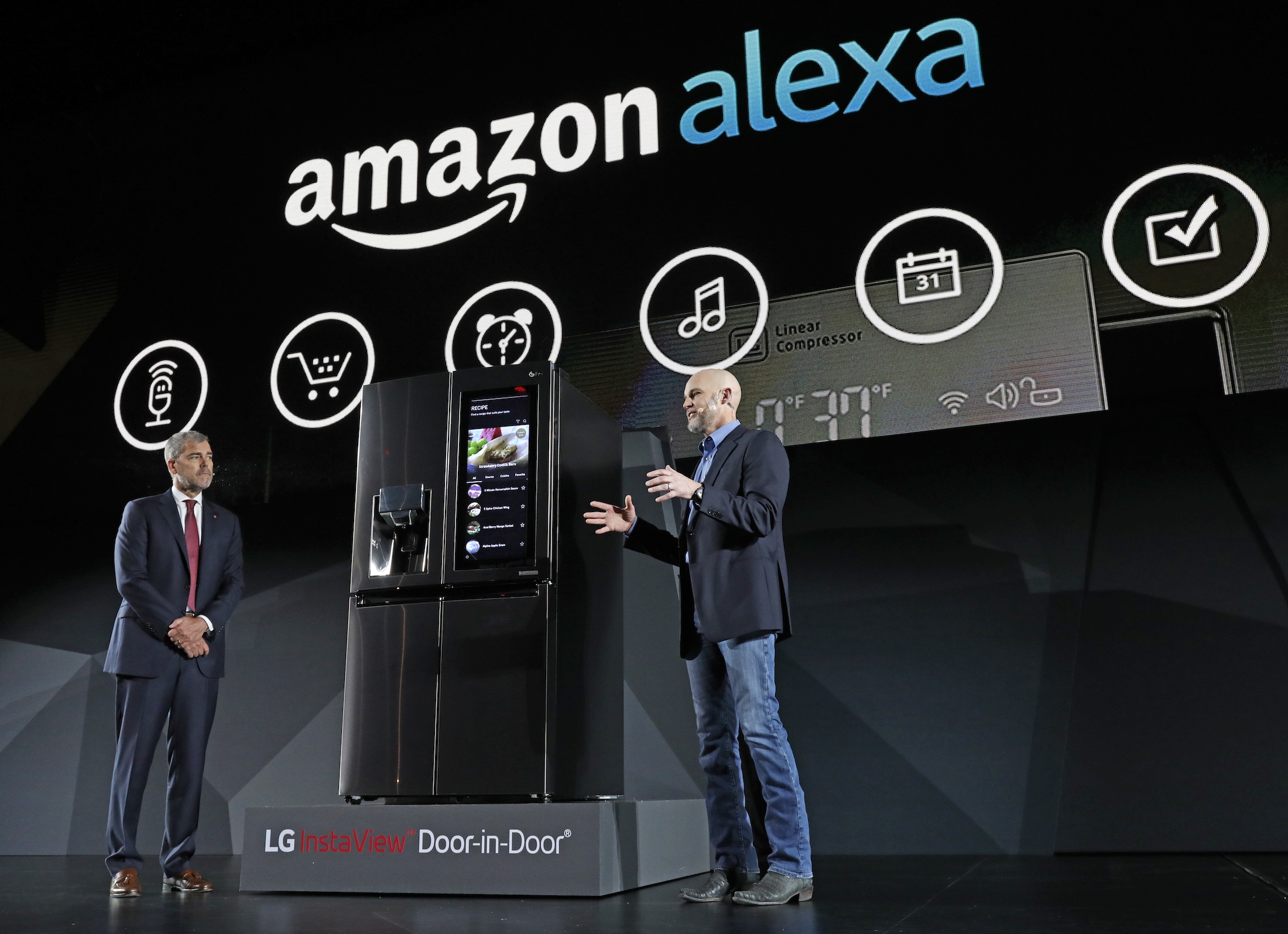 LG Electronics’ vice president David VanderWaal and Amazon Echo vice president Mike George present the LG Smart InstaView Door-in-Door Refrigerator to CES 2017 attendees at the LG Electronics press conference on Wednesday, Jan. 4, 2017, in Las Vegas. (Jack Dempsey/ AP)
