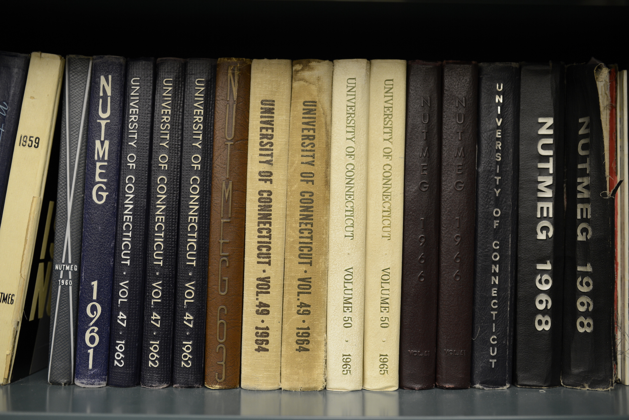 Nutmeg yearbooks through the years. Without an extra $2 per semester to cover production costs, the publication will not have sufficient funds by 2019. (Jason Jiang/The Daily Campus)