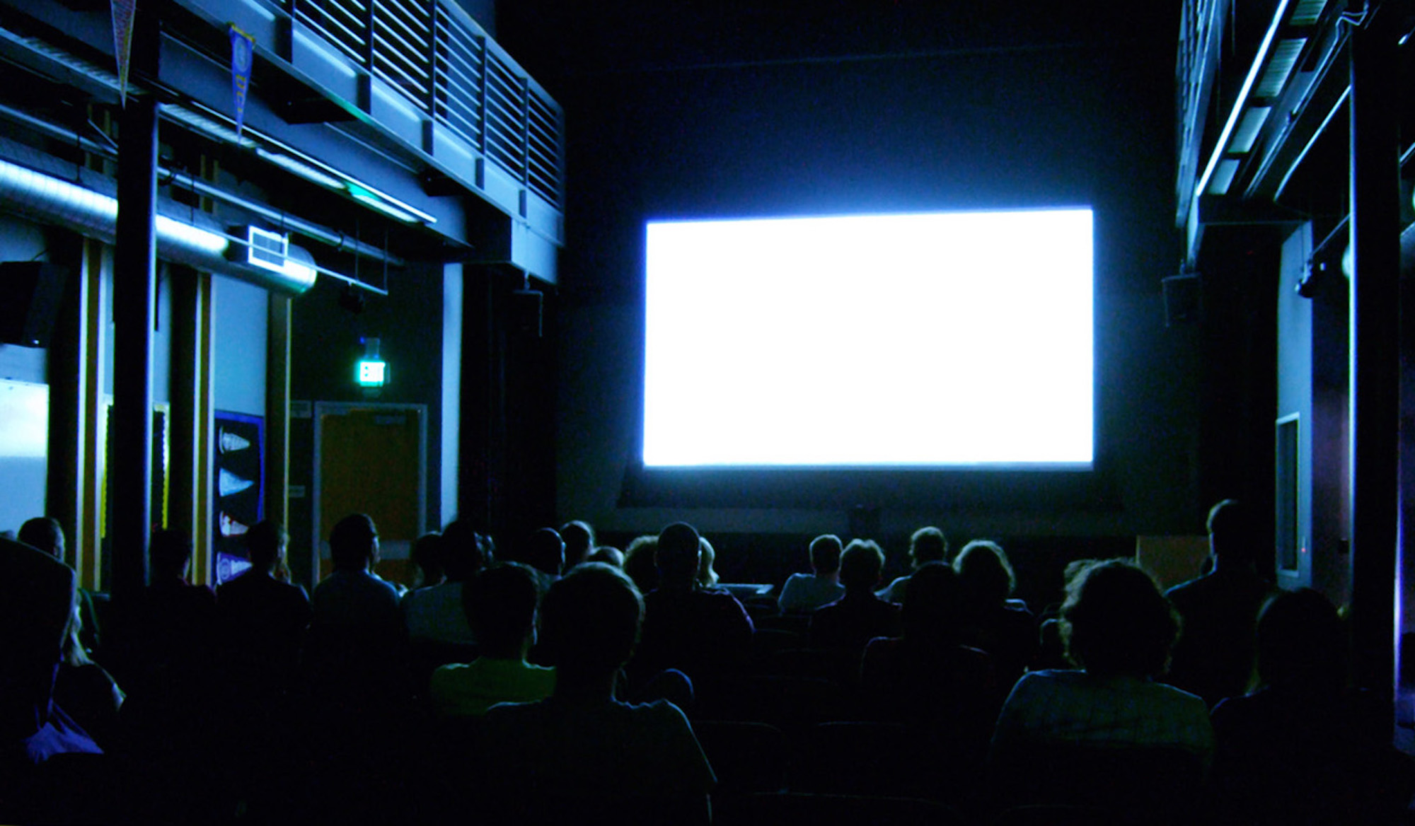 An audience watching a movie at the movie theater. Several well known books have been adapted into movies for this coming year. (Kenneth Lu/Creative Commons)