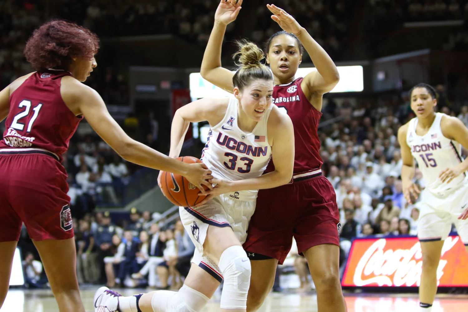 Katie Lou Samuelson attempts to retain possession of the ball while driving to the hoop. Samuelson was held to just 6 points on 2-for-12 shooting. (Jackson Haigis/The Daily Campus)