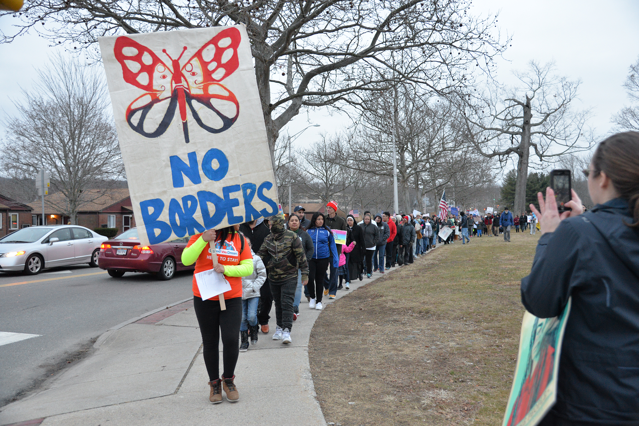 Willimantic and Windham residents gather in in Willimantic to show their support for undocumented students and immigrants in the face of Donald J Trump's inauguration. The protest was created by Iglesia del Sagrado Corazon and Embracing The Same Dream, Windham Area Progressive Action, CT Students For a Dream, and CT Immigrants Rights Alliance. The march started near the famous frog bridge ended at Town Hall. (Amar Batra/The Daily Campus)