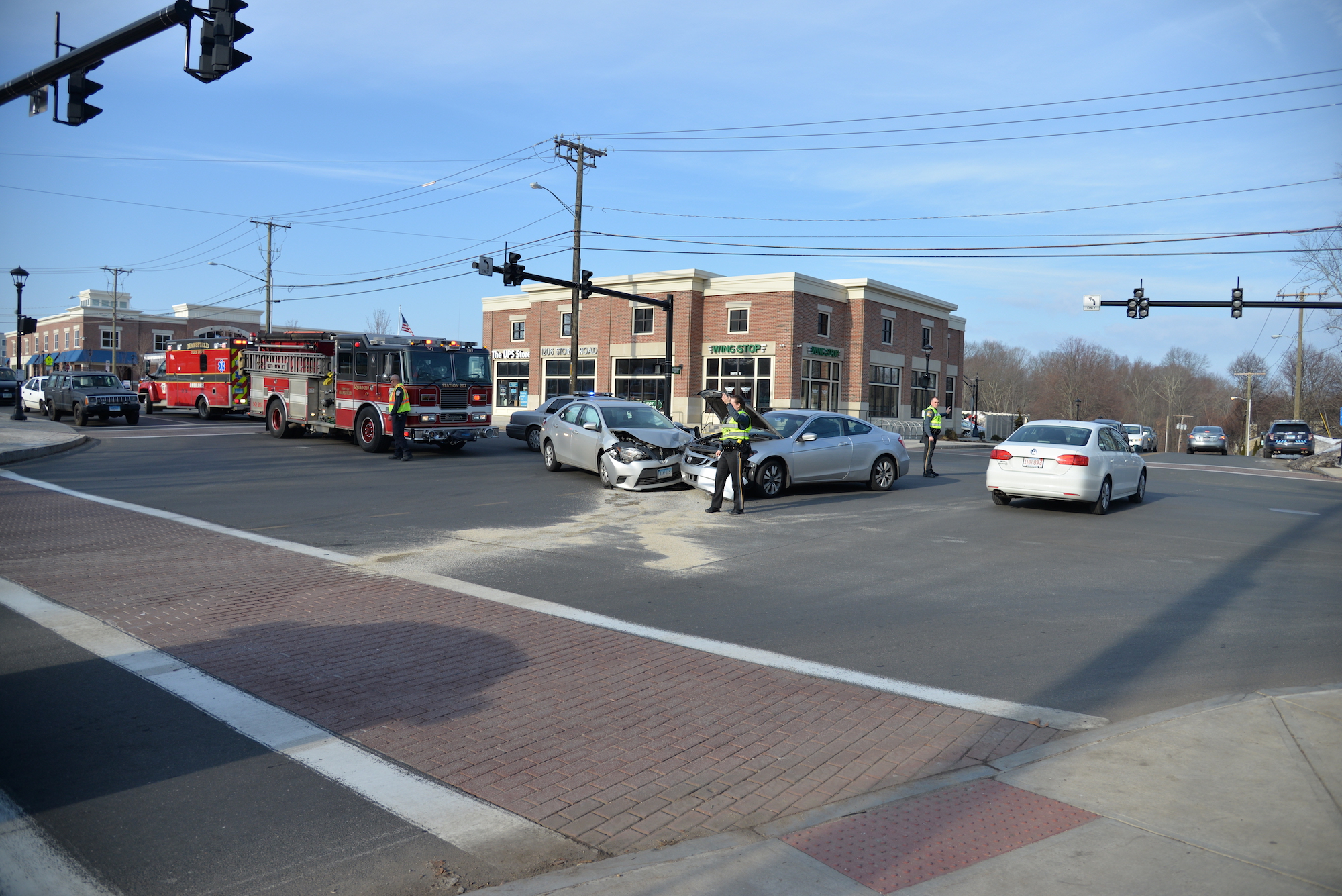 UConn police direct traffic around an accident that occurred at the intersection of South Eagleville Road and Interstate 95 on Wednesday afternoon. No one was seriously injured. (Amar Batra/The Daily Campus)