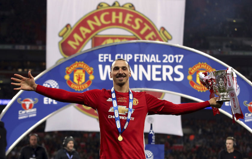 Manchester United's Zlatan Ibrahimovic celebrates with the trophy after his side won the League Cup Final soccer match by beating Southampton 3-2 at Wembley Stadium, London, Sunday Feb. 26, 2017. (Nick Potts/PA via AP)