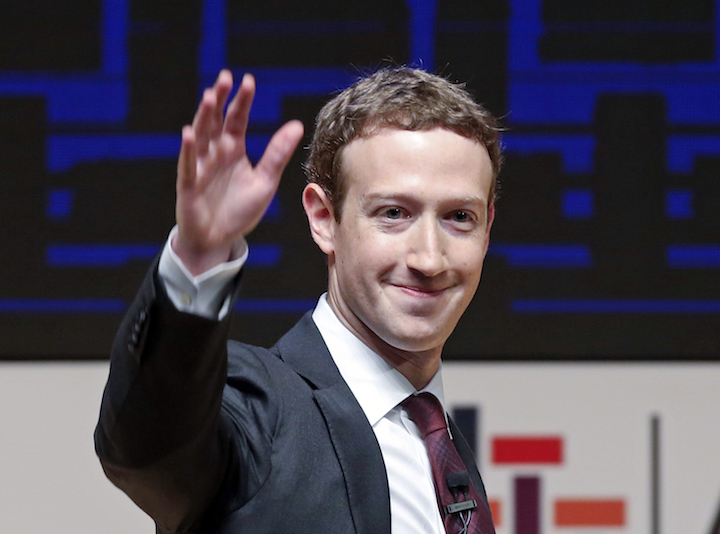 In this Nov. 19, 2016 file photo, Mark Zuckerberg, chairman and CEO of Facebook, waves at the CEO summit during the annual Asia Pacific Economic Cooperation (APEC) forum in Lima, Peru. Zuckerberg released a missive Thursday, Feb. 16, 2017, outlining his vision for the social network and the world at large. (AP Photo/Esteban Felix, File)