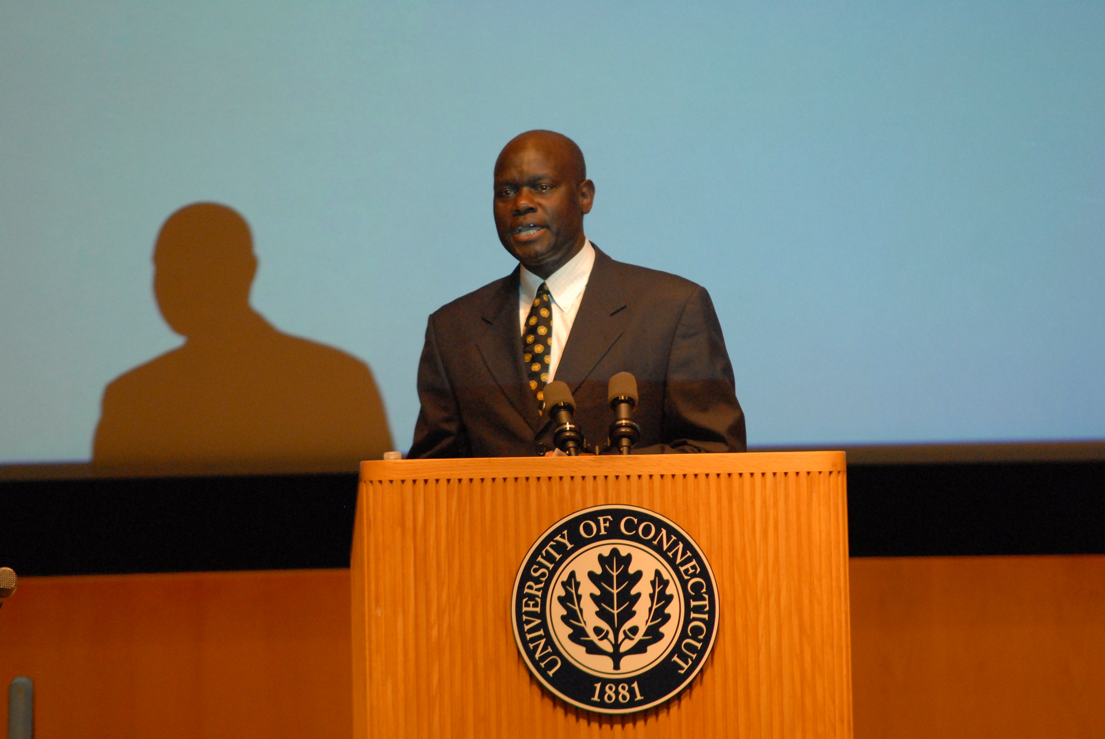 Dr. Amii Omara-Otunnu presents an award top a colleague on Sept. 11, 2012. He has recently been removed from his post as the UNESCO chair at UConn. (File Photo/The Daily Campus)