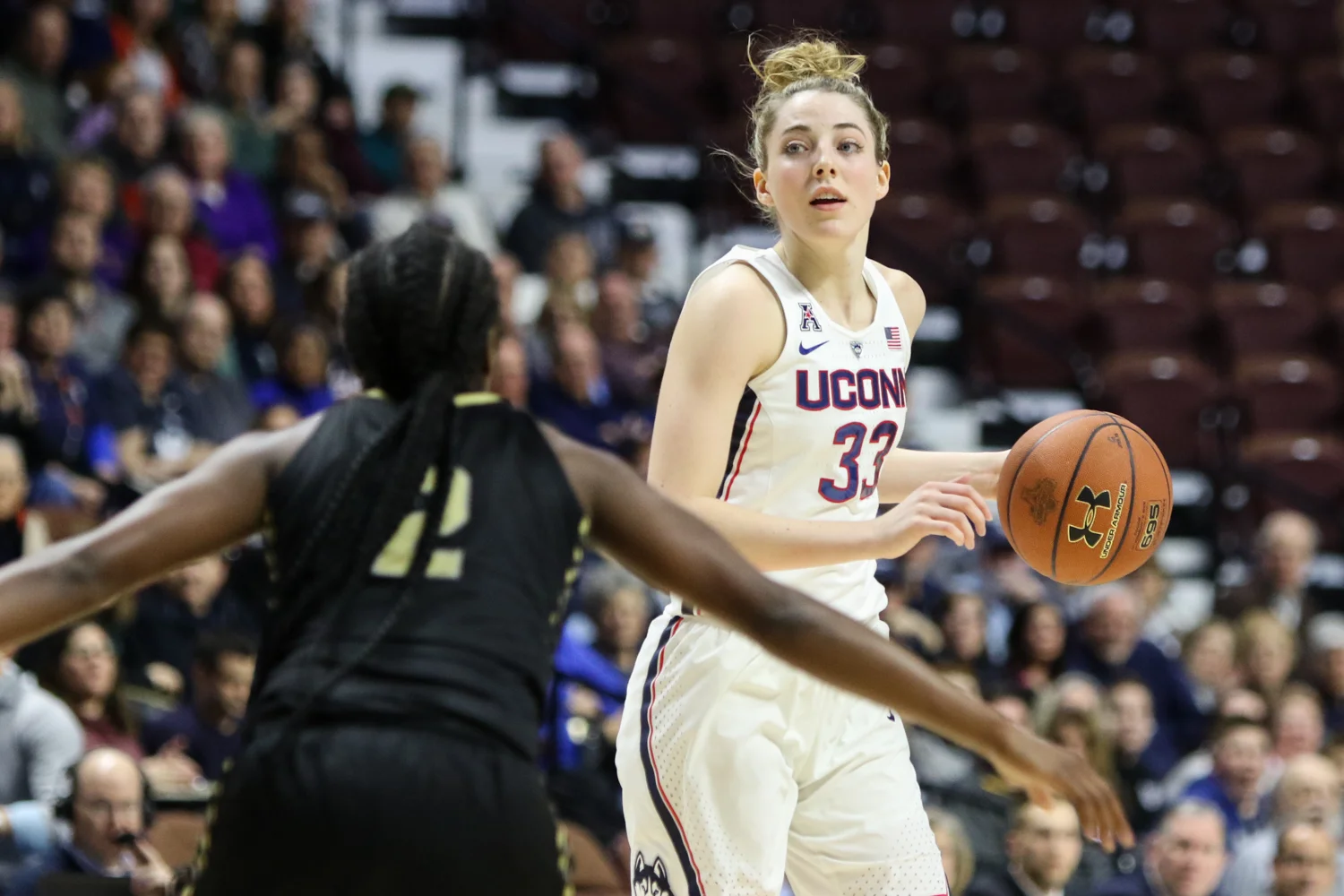 UConn guard Katie Lou Samuelson looks to pass during the Huskies' 78-56 win over UCF in the AAC semifinals on Sunday afternoon at Mohegan Sun Arena in Uncasville. Samuelson had 12 points, 5 rebounds, and 5 assists for UConn. (Jackson Haigis/The Daily Campus)
