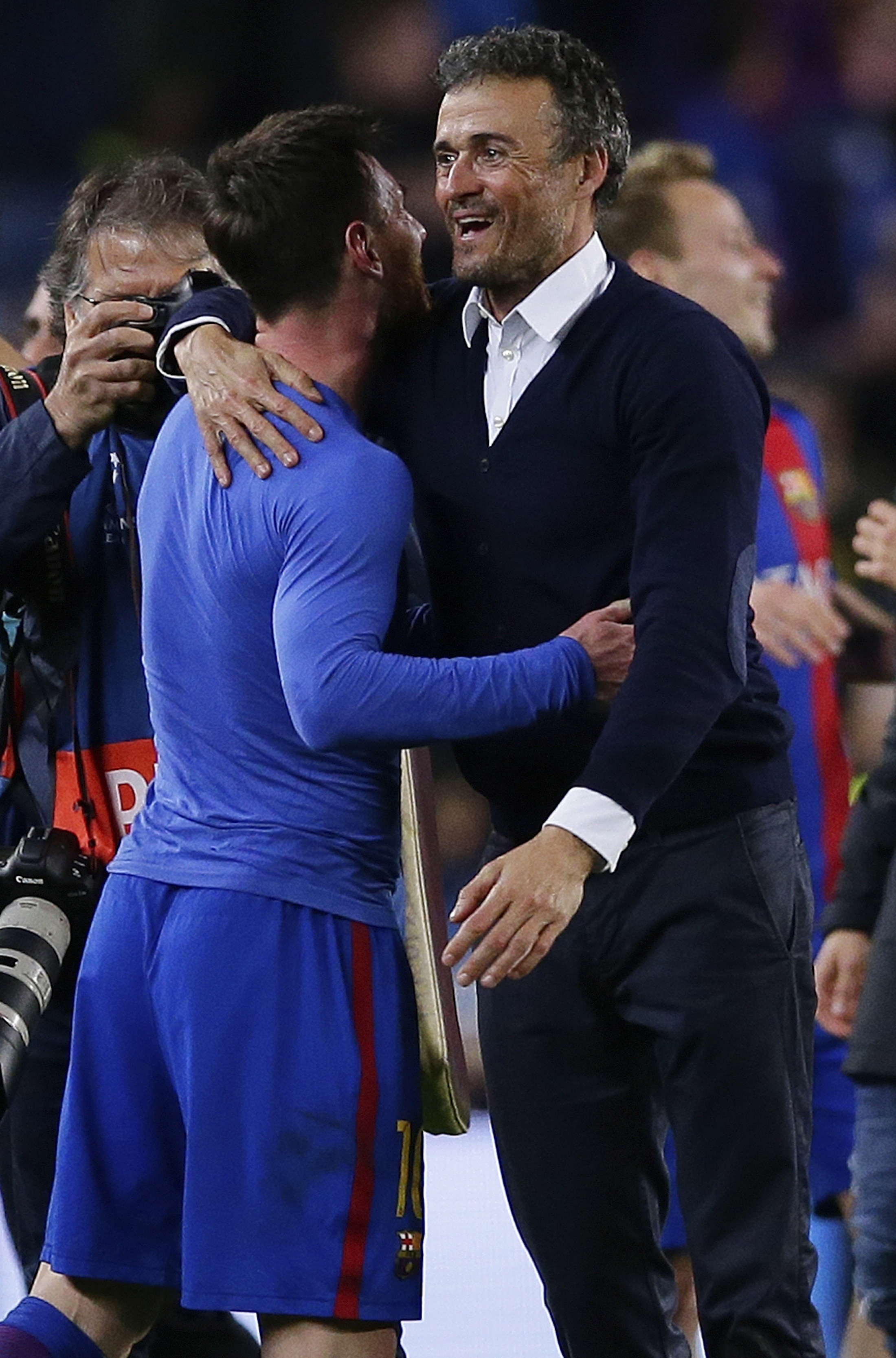 Barcelona's head coach Luis Enrique celebrates with Lionel Messi at the end of the Champions League round of 16. (Manu Fernandez/AP)