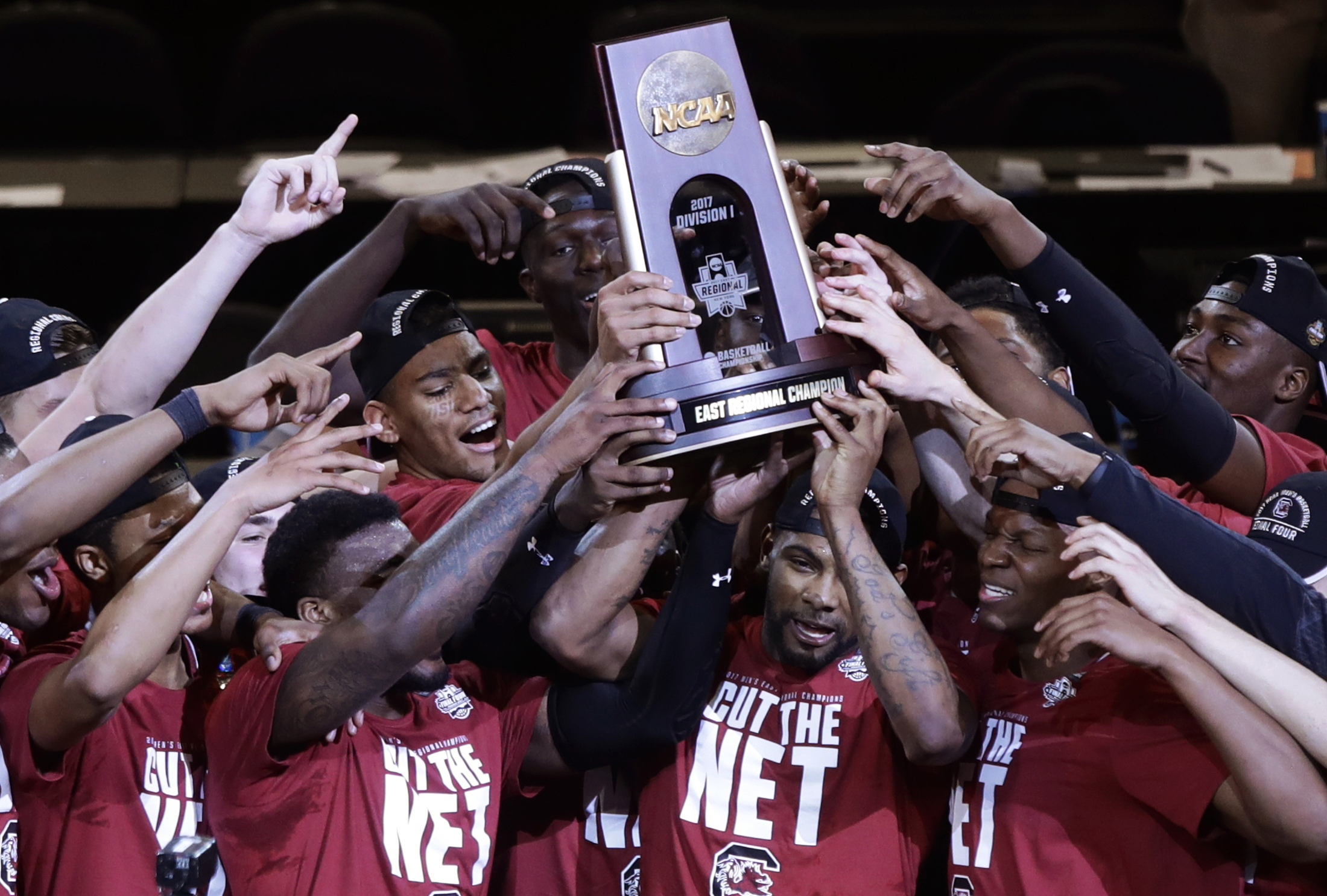 In this Sunday, March 26, 2017, file photo, South Carolina players celebrate after beating Florida 77-70 in the East Regional championship game of the NCAA men's college basketball tournament in New York. (Frank Franklin II, File/AP)