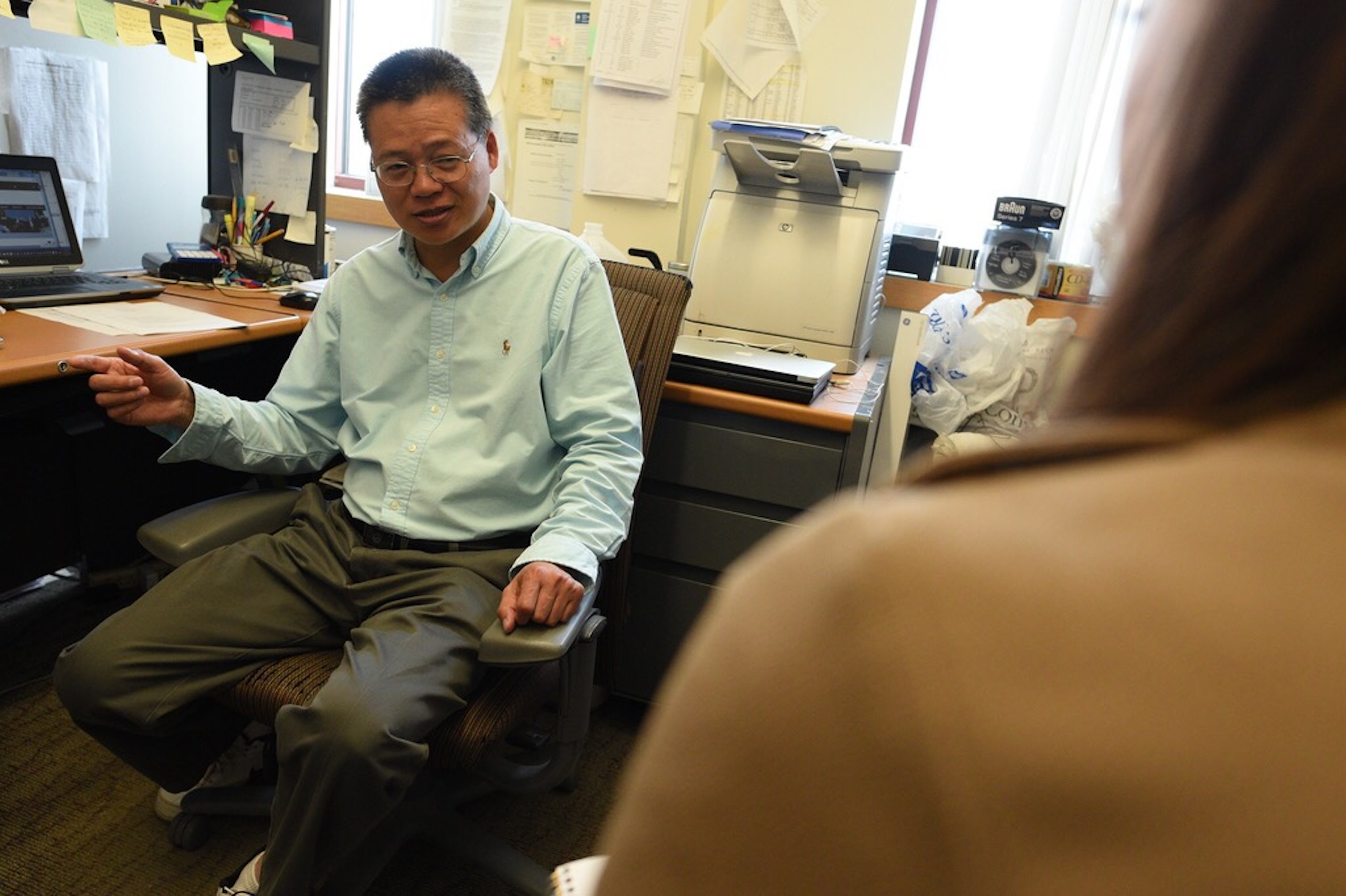Laijun Lai, Associate Research Professor in the Department of Allied Health Sciences at the University of Connecticut, talks about his latest research about cancer to a Daily Campus writer on March 29th. (Zhelun Lang/The Daily Campus)