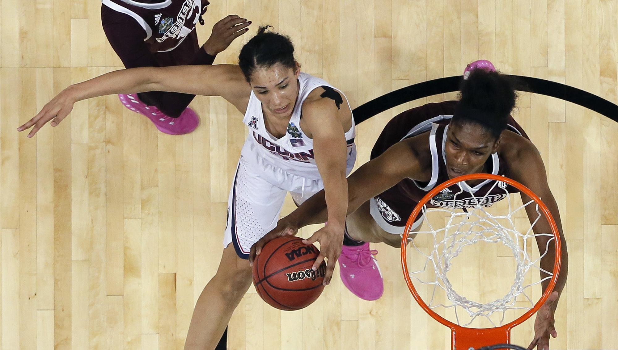 Connecticut guard Gabby Williams, left, is blocked by Mississippi State center Teaira McCowan, right, as she tries to score during the second half of an NCAA college basketball game in the semifinals of the women's Final Four, Friday, March 31, 2017, in Dallas.(Tony Gutierrez/ AP)