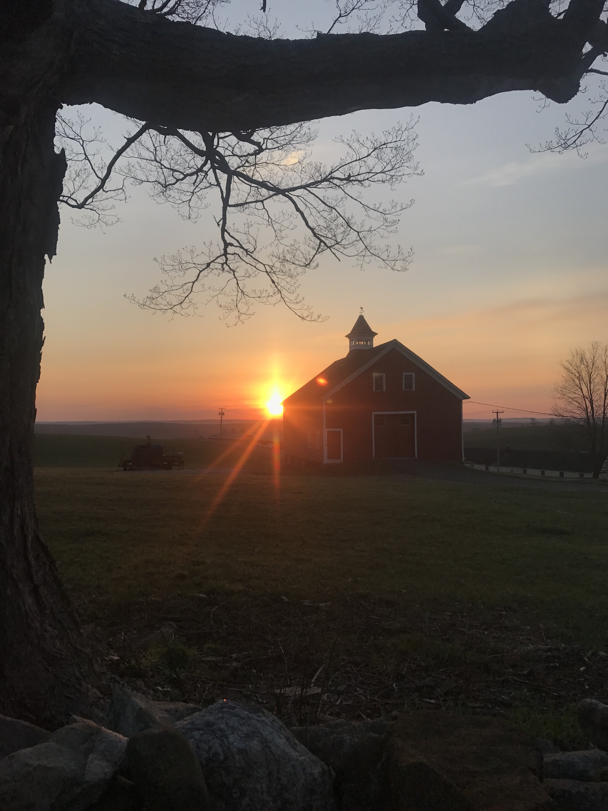 The sunrise over UConn’s Horsebarn Hill at 6:20 a.m. on Wednesday, April 12, 2017. The author stayed up all night to finish a photography portfolio assignment, heading home just in time for the day’s sunrise. (Francesca Colturi/The Daily Campus)