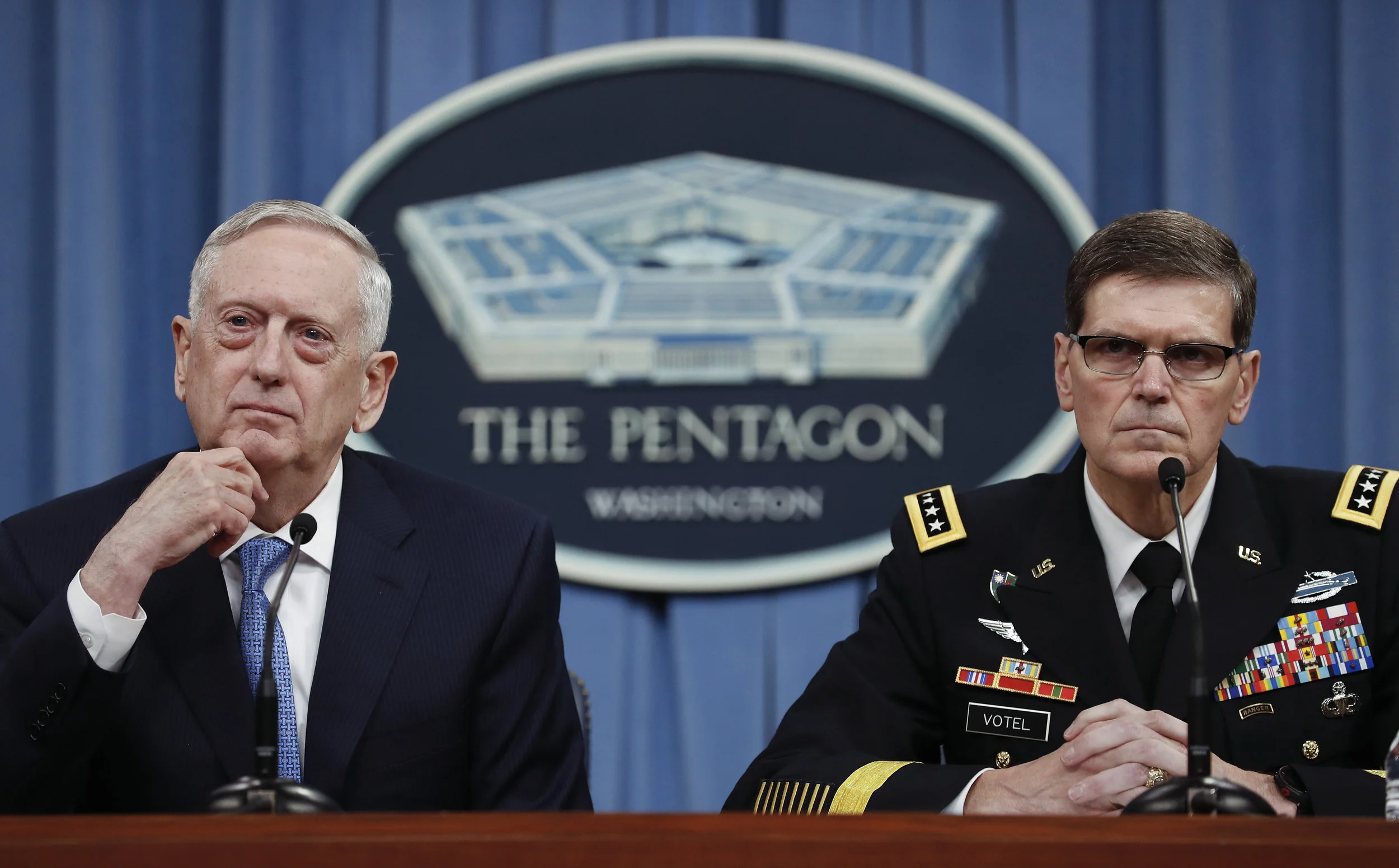 Defense Secretary Jim Mattis, left, and Gen. Joseph Votel, listen to questions during a news conference at the Pentagon, Tuesday, April 11, 2017. Mattis said the campaign against the Islamic State group is still the main focus of the U.S. in Syria and remains on track. (AP Photo/Carolyn Kaster)