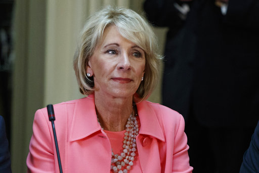 In this April 11, 2017 file photo, Education Secretary Betsy DeVos is seen in the State Department Library of the Eisenhower Executive Office Building on the White House complex in Washington. (AP Photo/Evan Vucci, File)