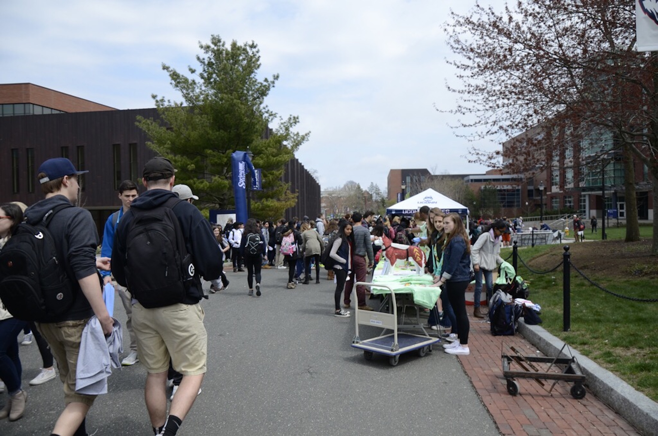 Students prepare for Spring Weekend as they line up to get free stuff at the various vendors on Fairfield Way. (Charlotte Lao/The Daily Campus)