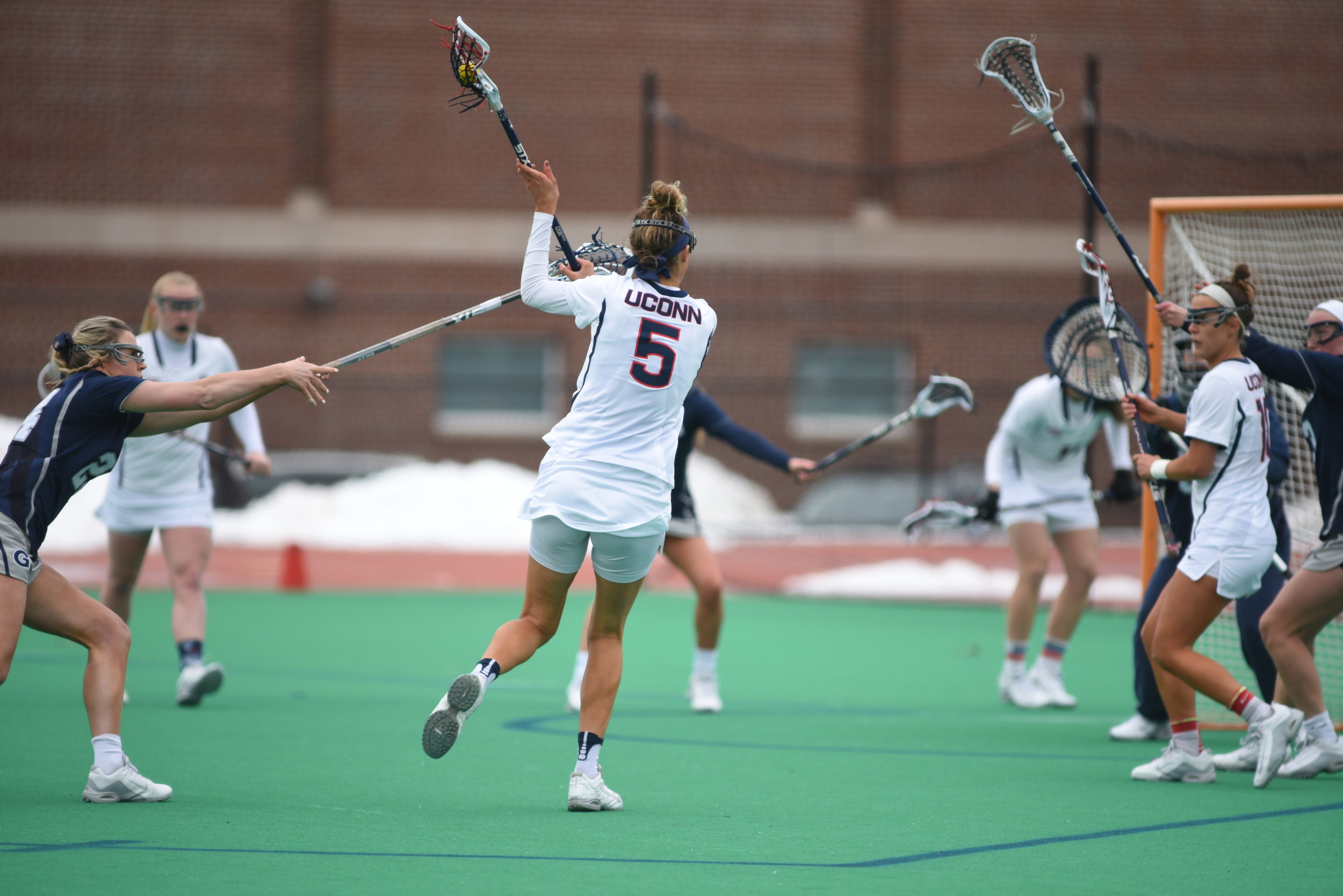Molly O'Reilly (#5) fires a shot on net during UConn's game against Georgetown on March 25, 2017. The Huskies dropped the contest 14-6. (Charlotte Lao/The Daily Campus)