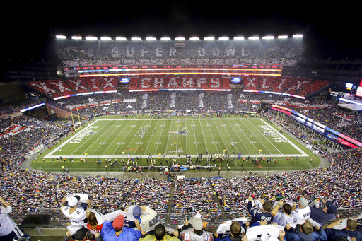 In this Thursday, Sept. 10, 2015, file photo, the New England Patriots fans perform a card stunt commemorating their Super Bowl win before a game against the Pittsburgh Steelers, at Gillette Stadium, in Foxborough, Mass. (AP Photo/Gregory Payan, File)