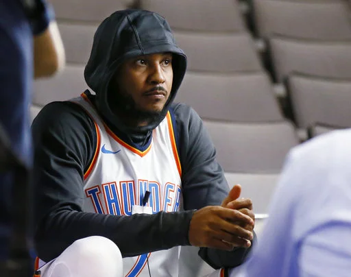 Oklahoma City Thunder forward Carmelo Anthony waits for an interview to begin during an NBA basketball media day in Oklahoma City, Monday, Sept. 25, 2017. (AP Photo/Sue Ogrocki)
