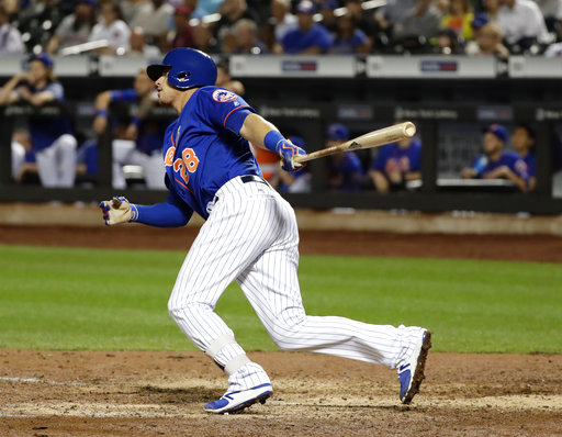 New York Mets' Travis Taijeron watches his single that drove in the winning run during the ninth inning of a baseball game against the Atlanta Braves on Tuesday, Sept. 26, 2017, in New York. The Mets won 4-3. (AP Photo/Frank Franklin II)