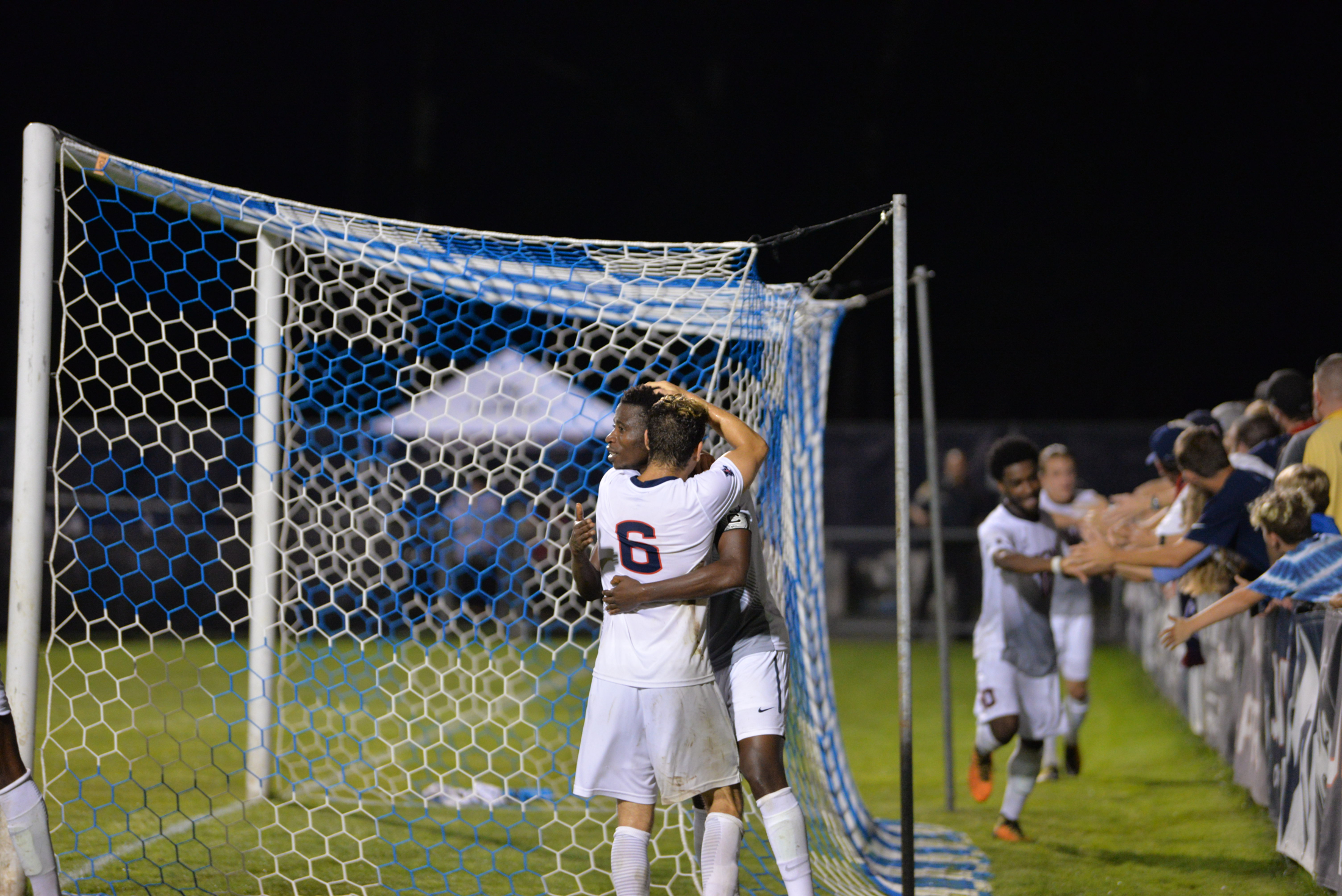 UConn's Abdou Mbacke Thiam and Dylan Greenberg celebrate after the game-winning goal Tuesday night. (Amar Batra/The Daily Campus)