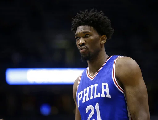 In this Jan. 16, 2017, file photo, Philadelphia 76ers' Joel Embiid watches during an NBA basketball game against the Milwaukee Bucks in Milwaukee. (AP Photo/Aaron Gash, File)